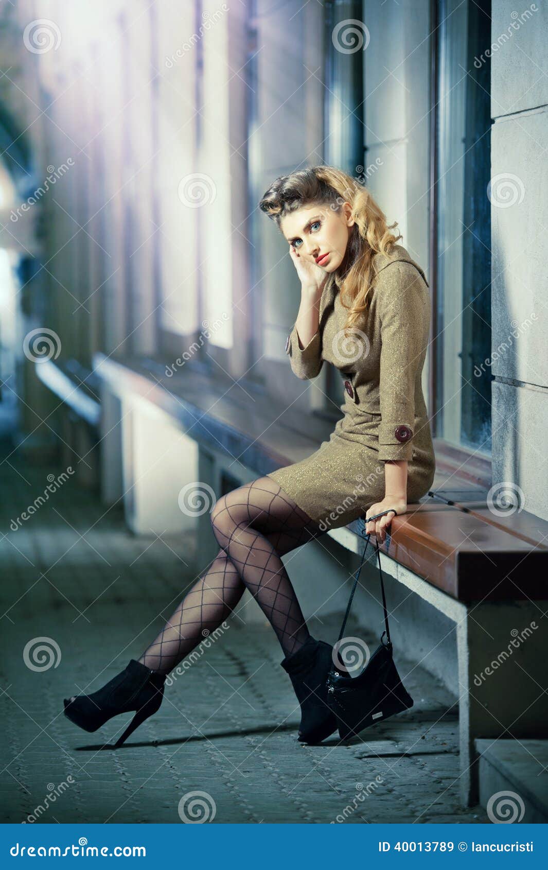 Fashion Model with Long Legs Sitting on Bench Thinking Stock Image ...