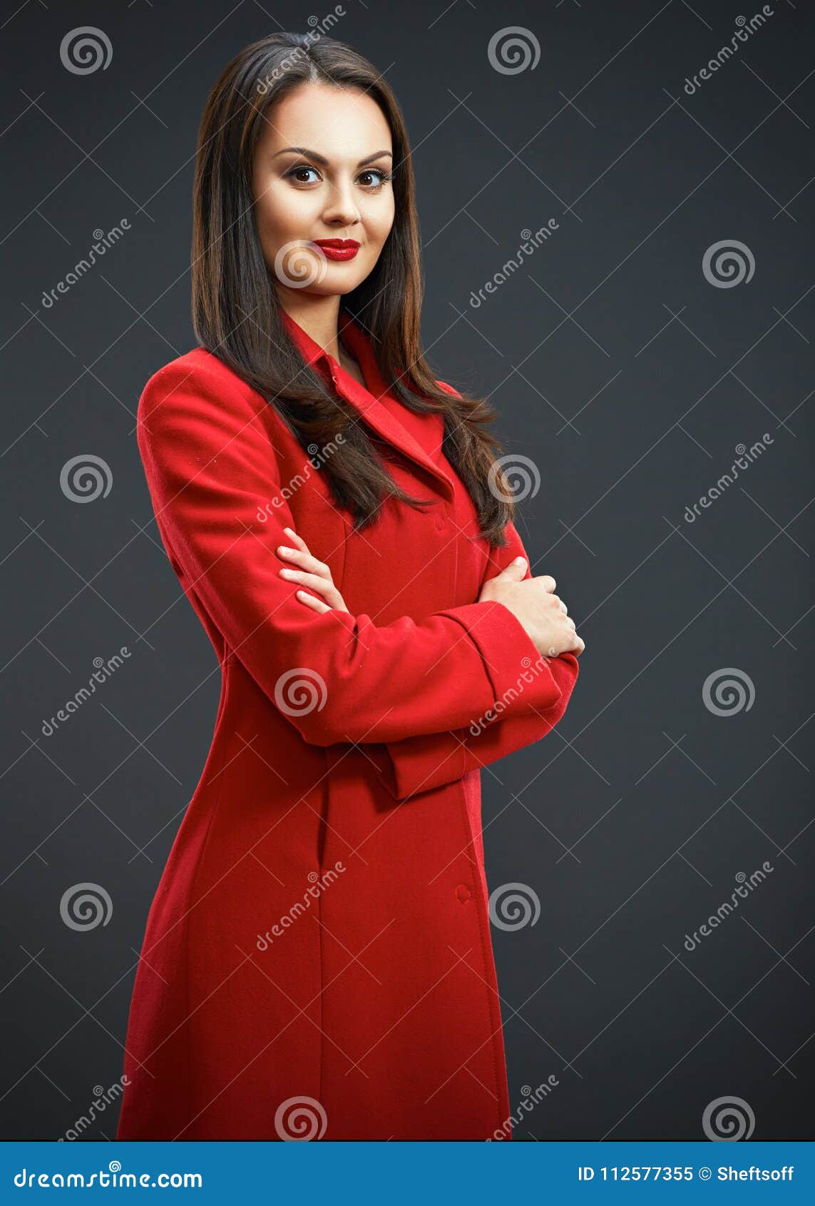 Fashion Model Posing in Studio with Red Coat. Isolated Portrait Stock ...