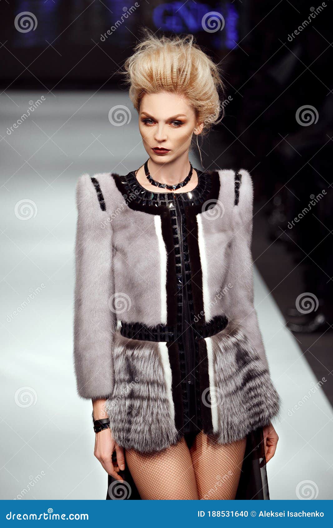 Fashion Model Walks on Runway in Fur Coat Stock Photo - Image of blonde ...