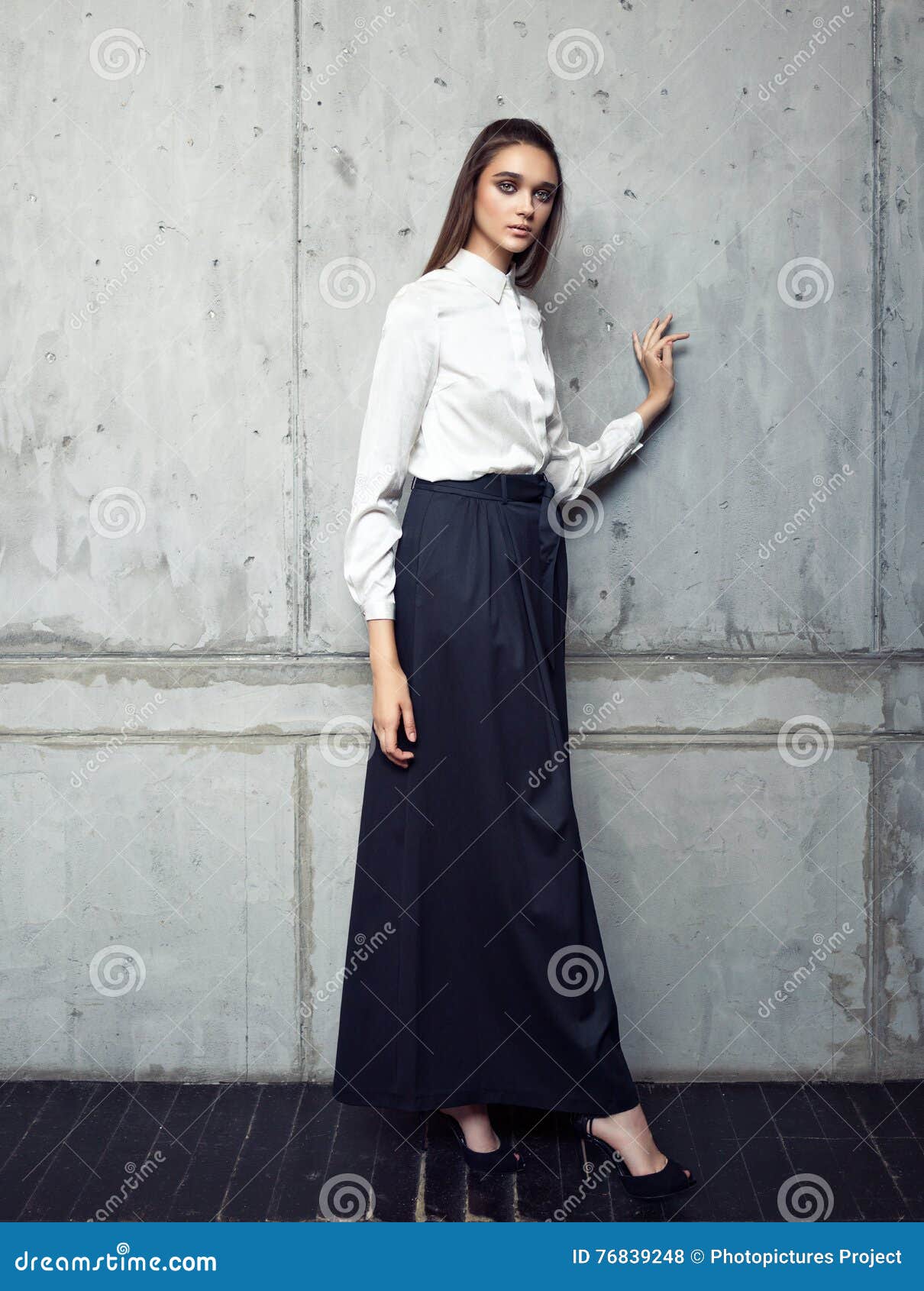 Fashion Model Wearing White Shirt and Long Black Skirt Posing in Studio  Stock Photo - Image of sensual, high: 76839248