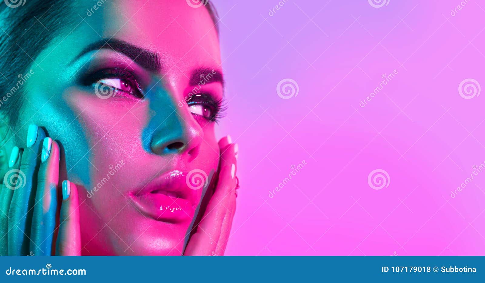 fashion model woman in colorful bright lights with trendy makeup and manicure