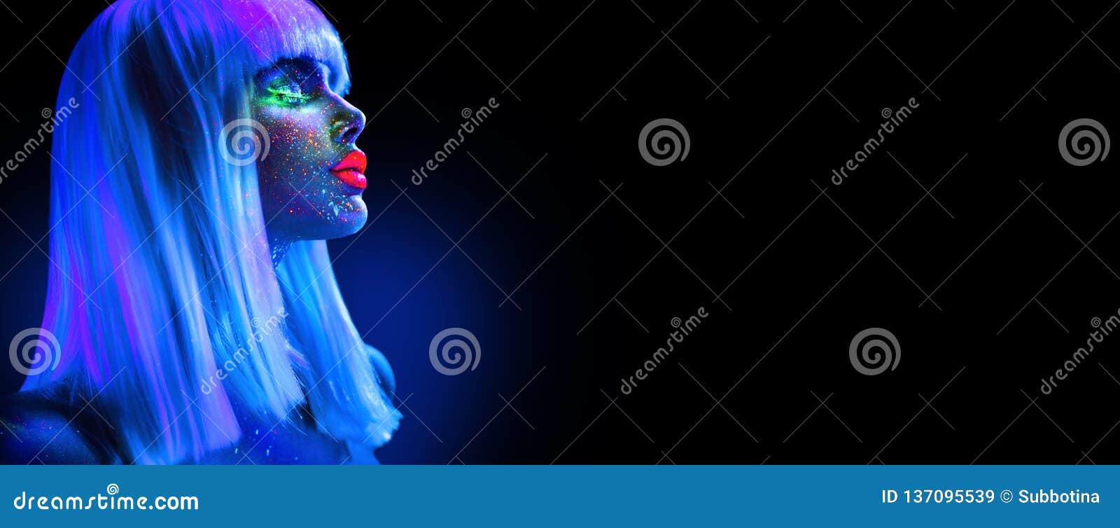 fashion model woman in neon light. beautiful model girl with colorful bright fluorescent makeup  on black. ultraviolet