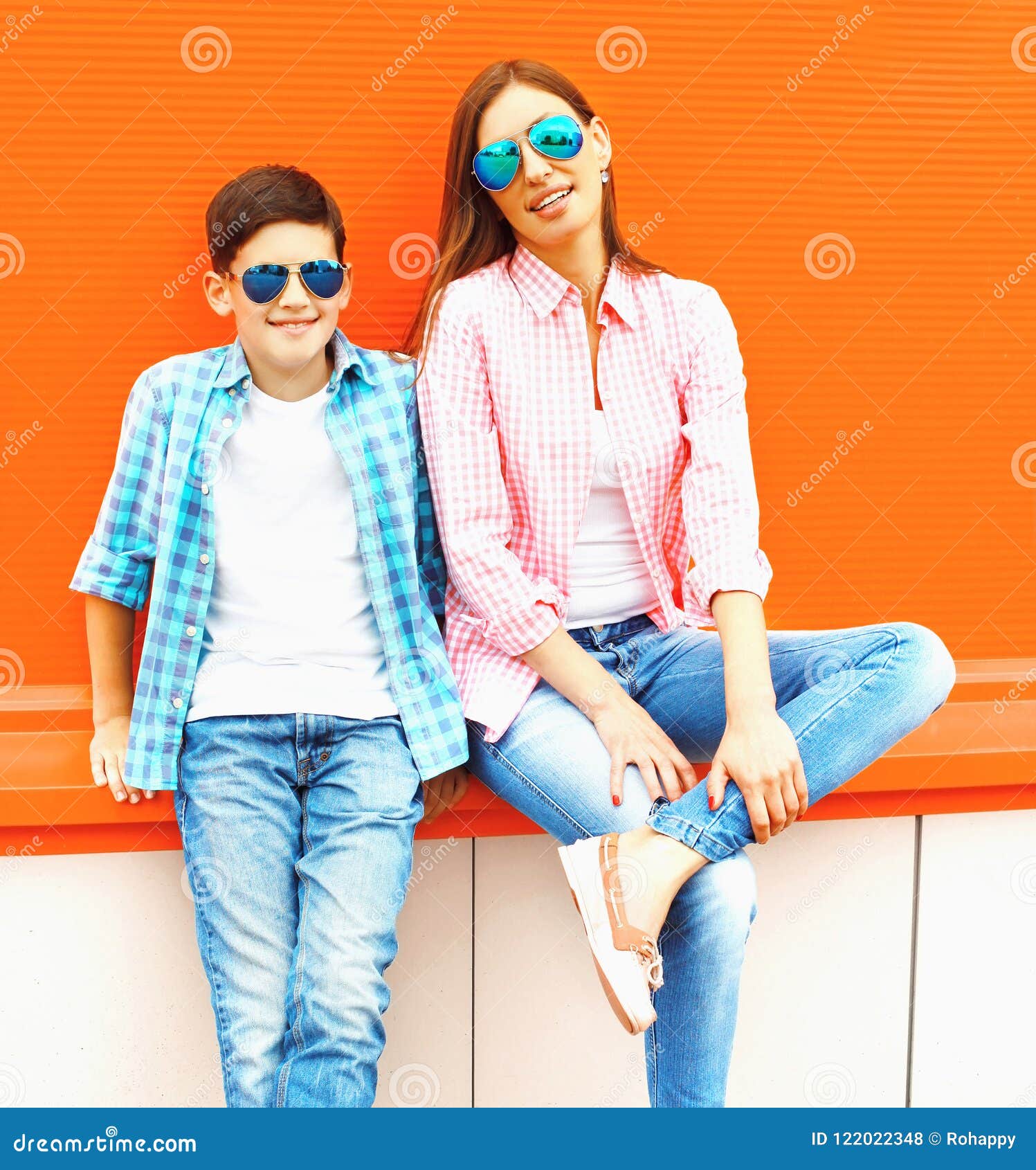 Fashion Mother with Son Teenager in a Sunglasses, Checkered Shirt