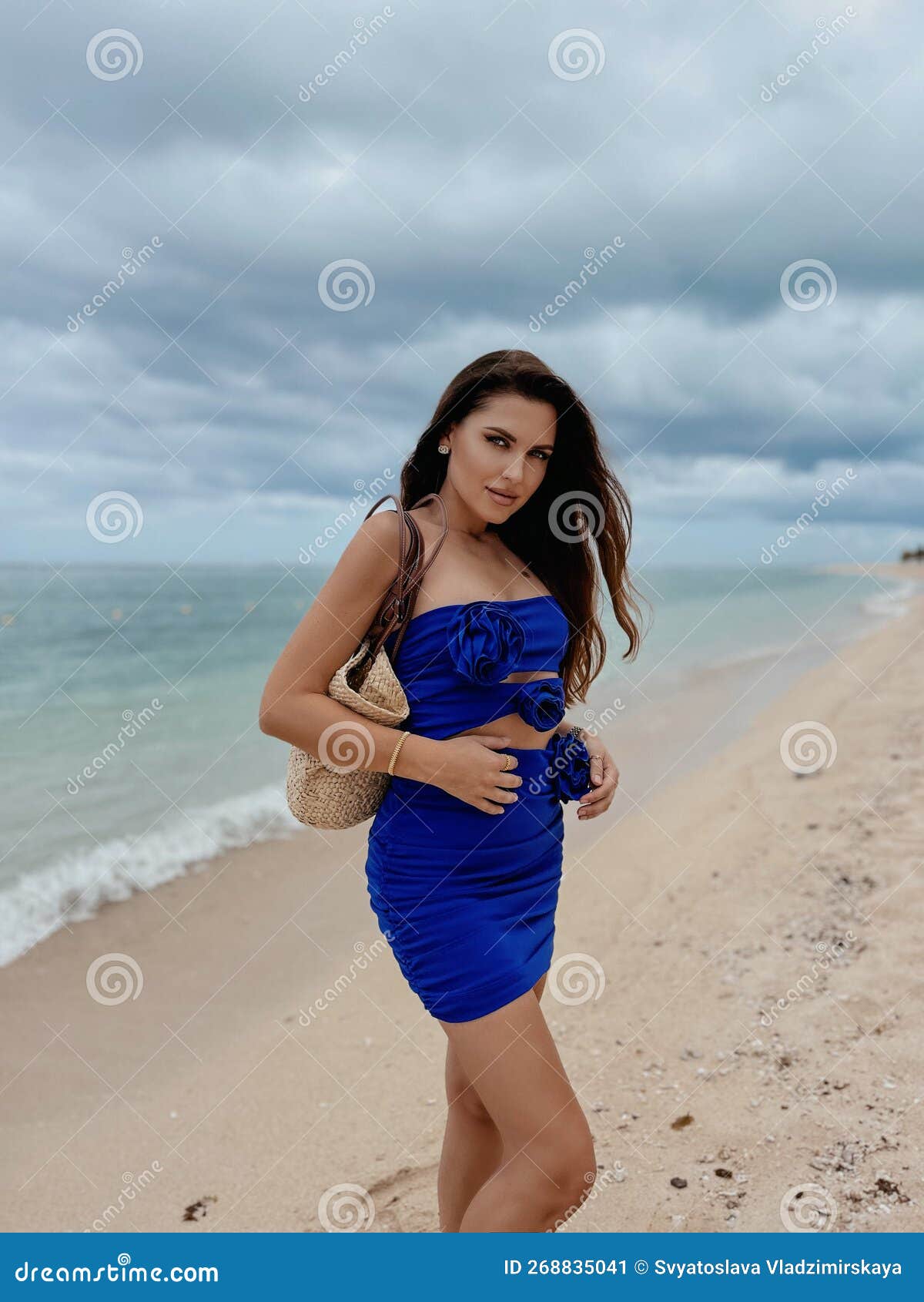 Beautiful Woman With Dark Hair In Elegant Blue Dress Posing At The Beach Stock Image Image Of 