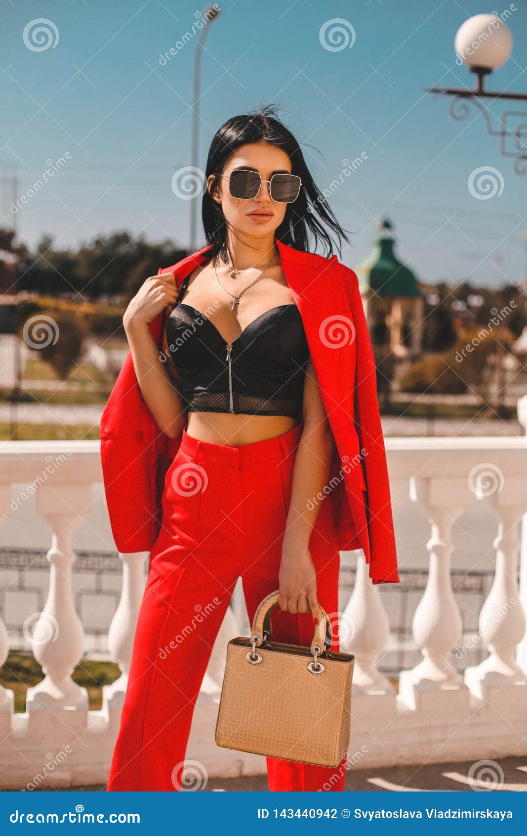 Woman with Dark Hair in Elegant Red Suit with Accessories Stock Photo -  Image of bright, beautiful: 143440942