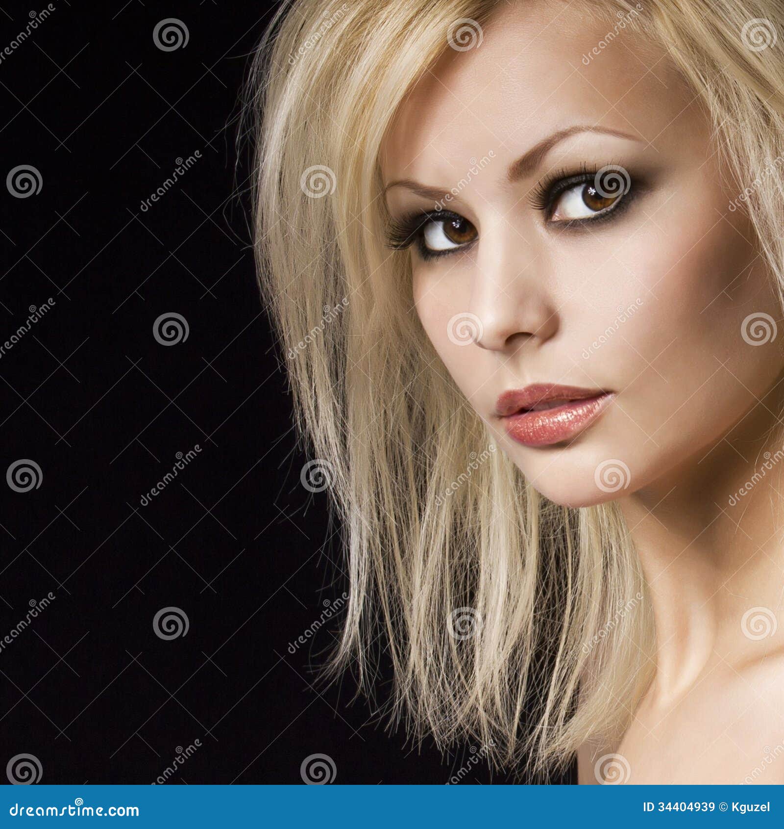 fashion portrait. beautiful blonde woman with professional makeup and hairstyle, over black. vogue style model