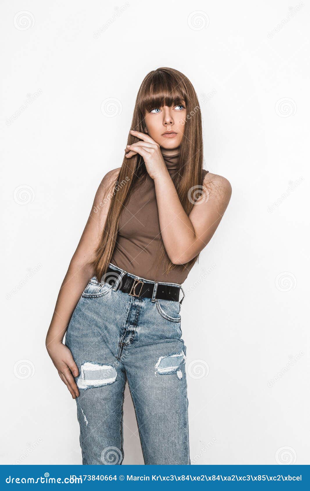Portrait of a Sad Young Woman in Top and Jeans. Posing in the Studio on a  White Background Stock Photo - Image of closeup, color: 113551866