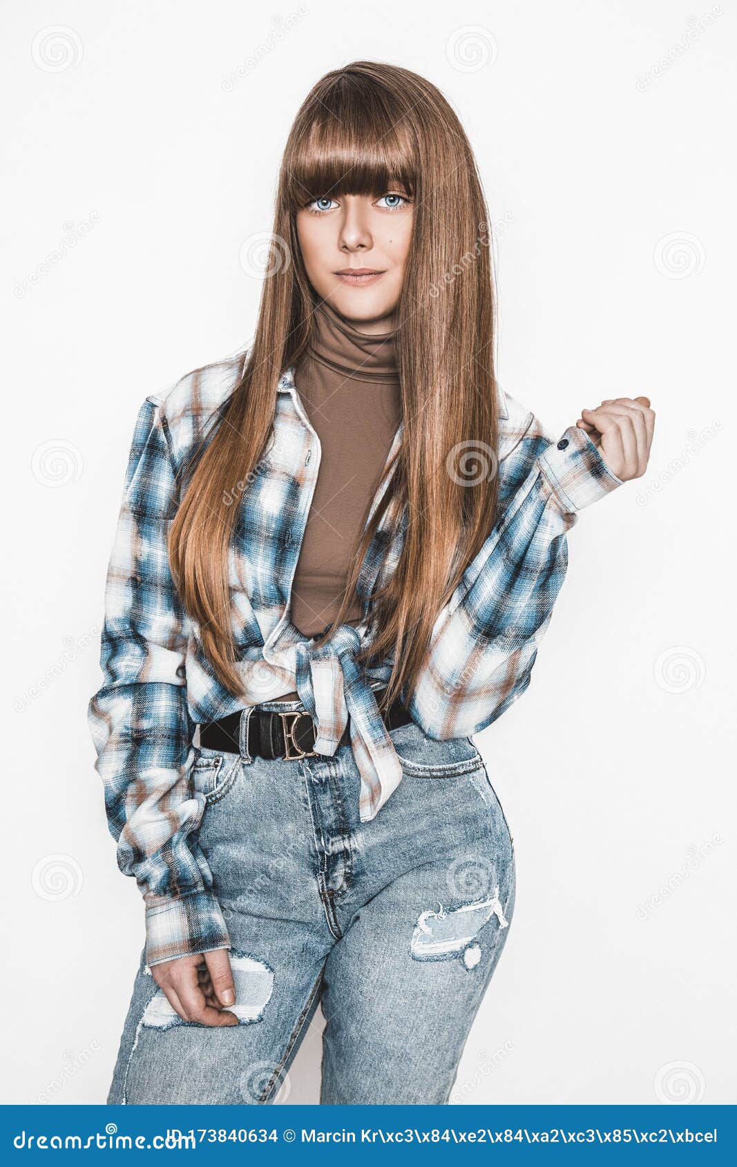 Fashion Portrait of Beautiful Young Woman with dark Hair. Girl in Blouse  and Jeans. Jewelry and Hairstyle. Girl with Handbag Stock Photo | Adobe  Stock