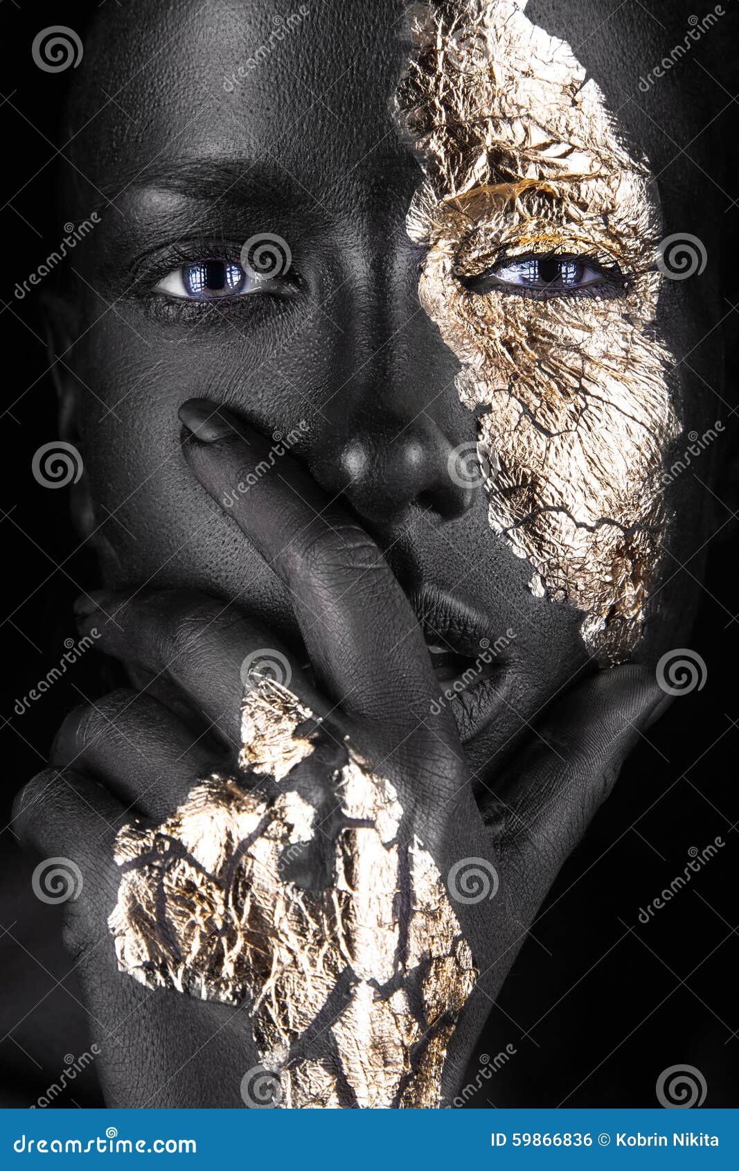 fashion portrait of a dark-skinned girl with gold