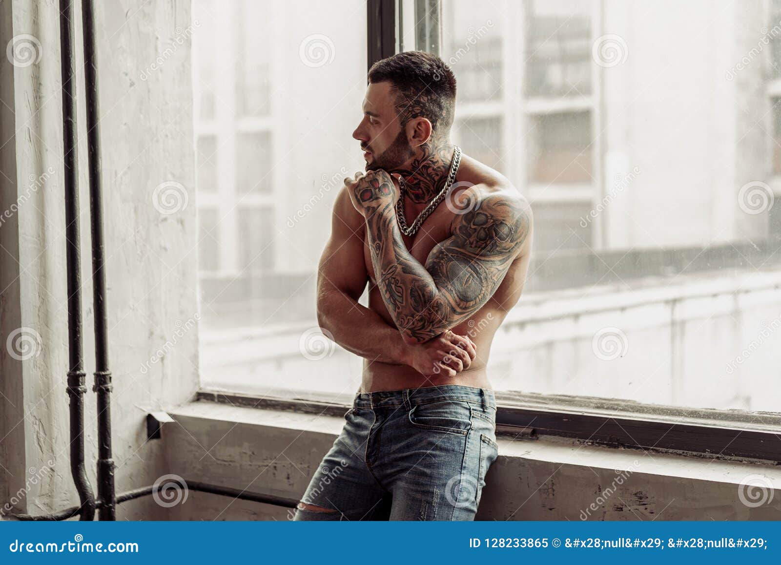 Aggressive muscular male model with tattoos  a Royalty Free Stock Photo  from Photocase