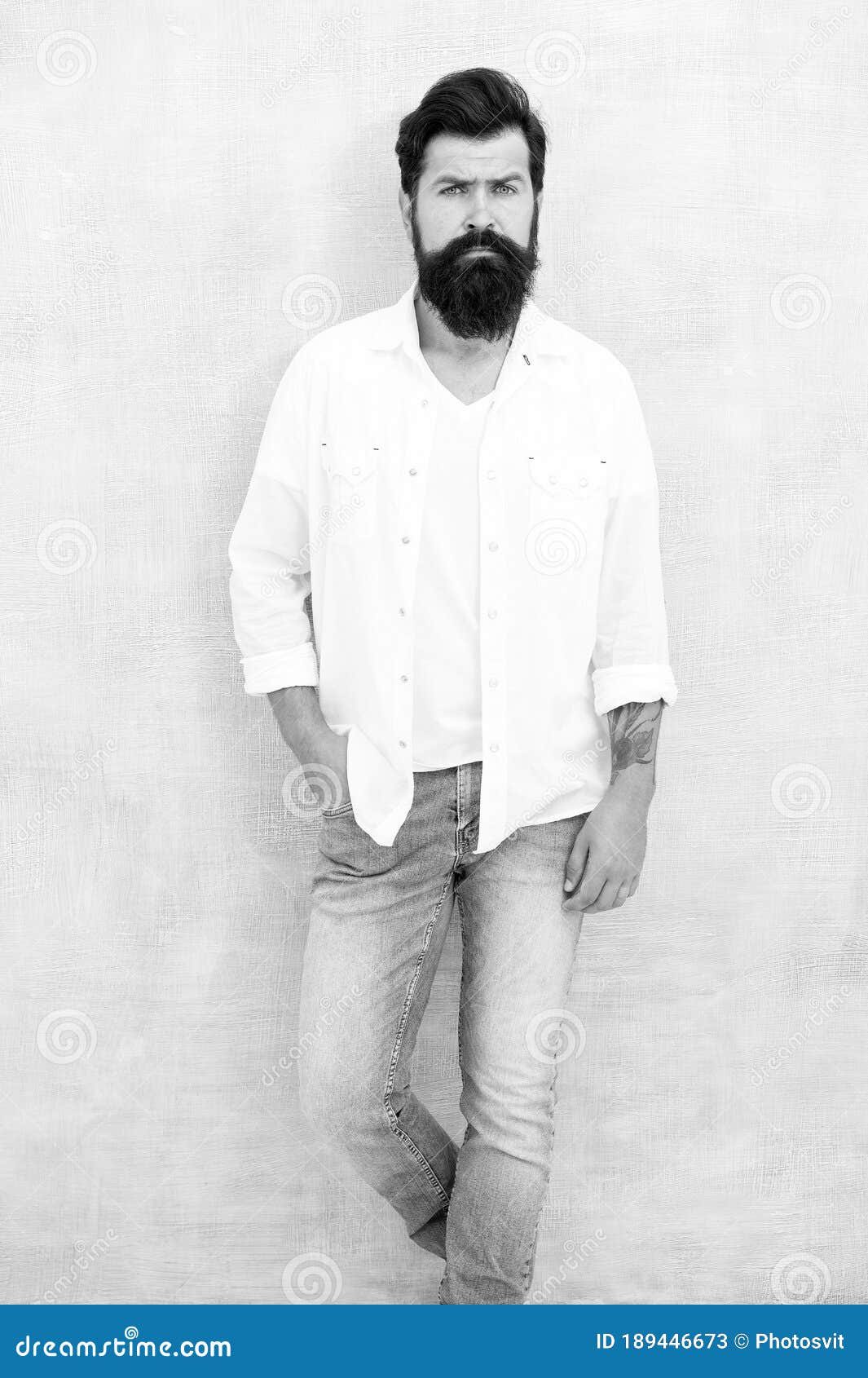 Fashion Portrait of Young Bearded Man. Hipster Guy Wear Jeans and Shirt ...