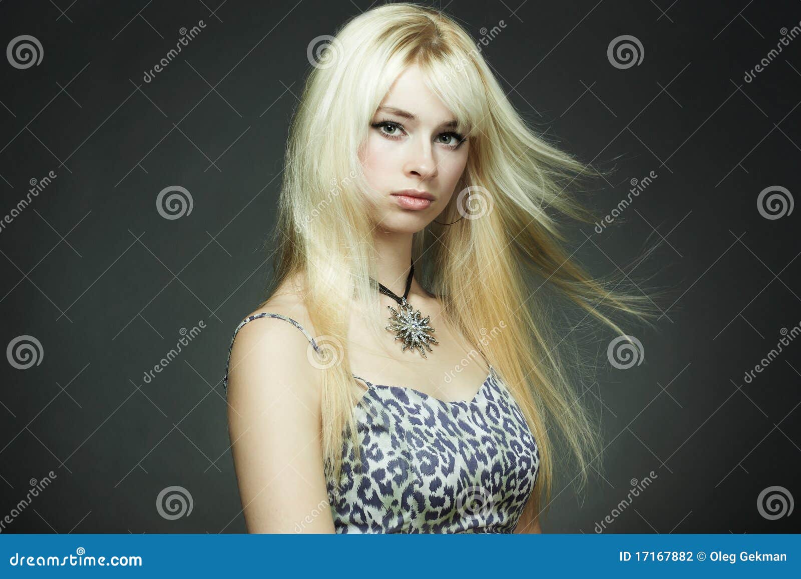 Stockfoto med beskrivningen Seductive blond-haired woman with
