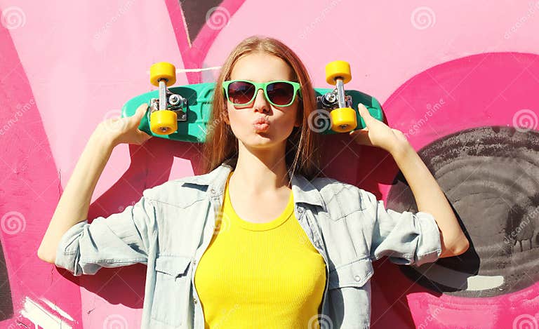 Fashion Pretty Cool Girl Wearing a Sunglasses and Skateboard Stock ...
