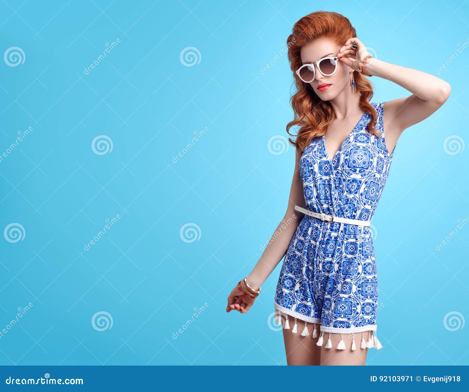 Fashion Redhead Model in Sexy Jumpsuit. Stylish Mohawk hairstyle, fashion  Sunglasses, Summer Floral Party Outfit. Beauty Woman in Trendy Summer  Dress. Glamour fashion Lady. Playful Luxury Girl on Pink Stock Photo |