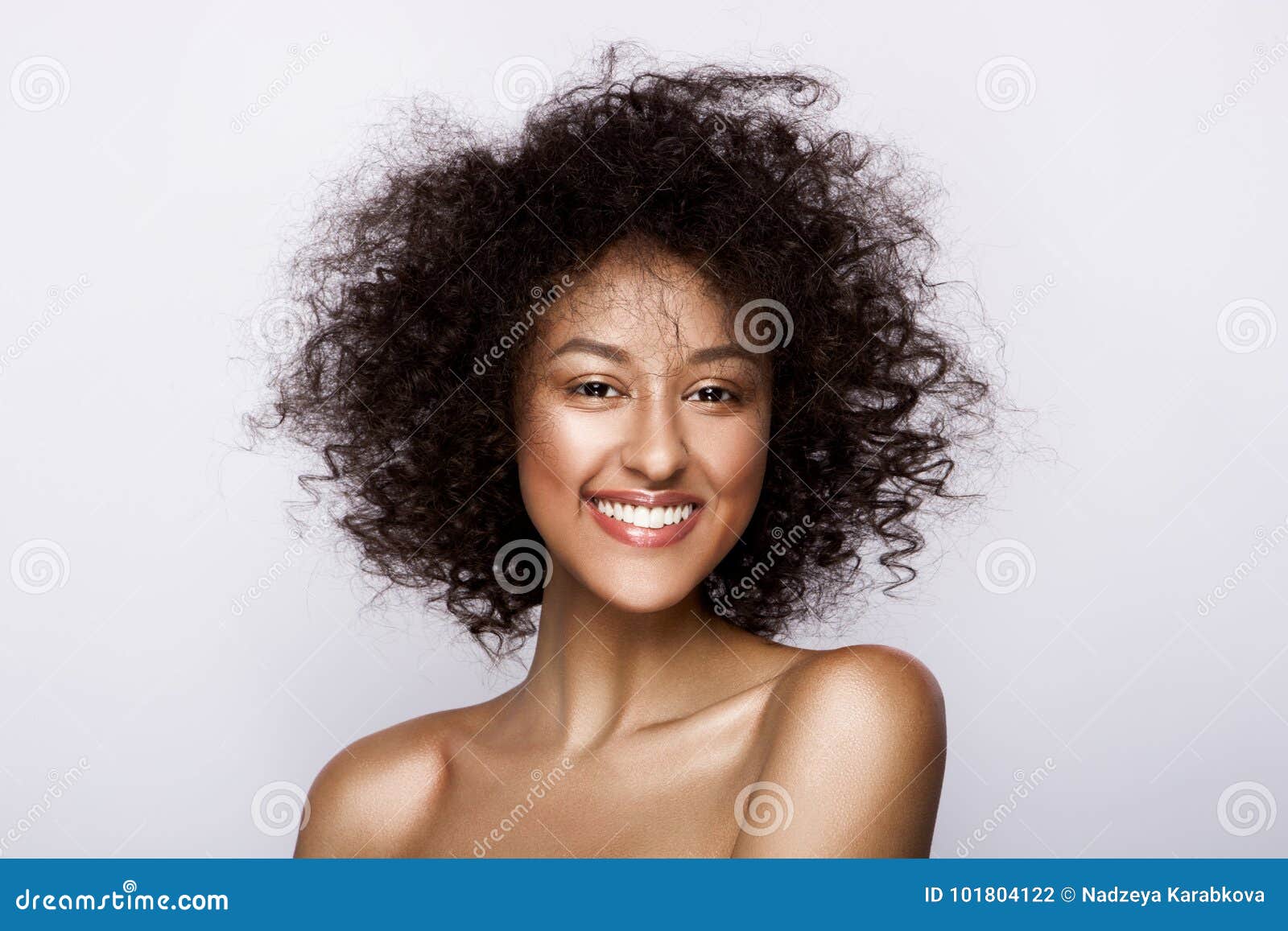 fashion studio portrait of beautiful african american woman with perfect smooth glowing mulatto skin, make up