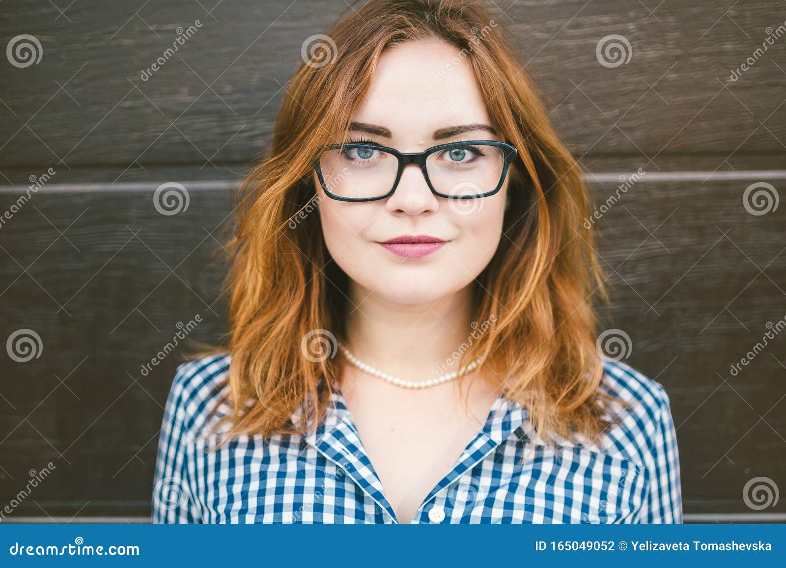 Fashion summer dress woman. Female eye wear. Attractive redhead girl wearing dress retro vintage style. beauty woman wearing glasses. health and vision concept, close up woman wearing eyeglasses.