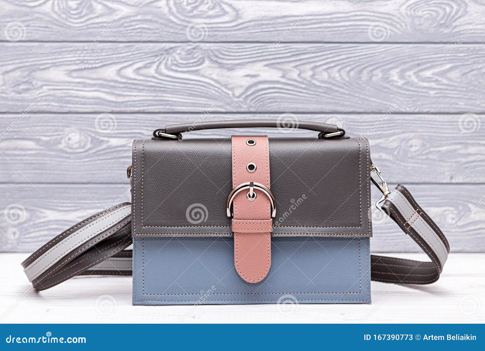 Fashion Synthetic Leather Blue and Grey Handbag on a Wooden Background ...