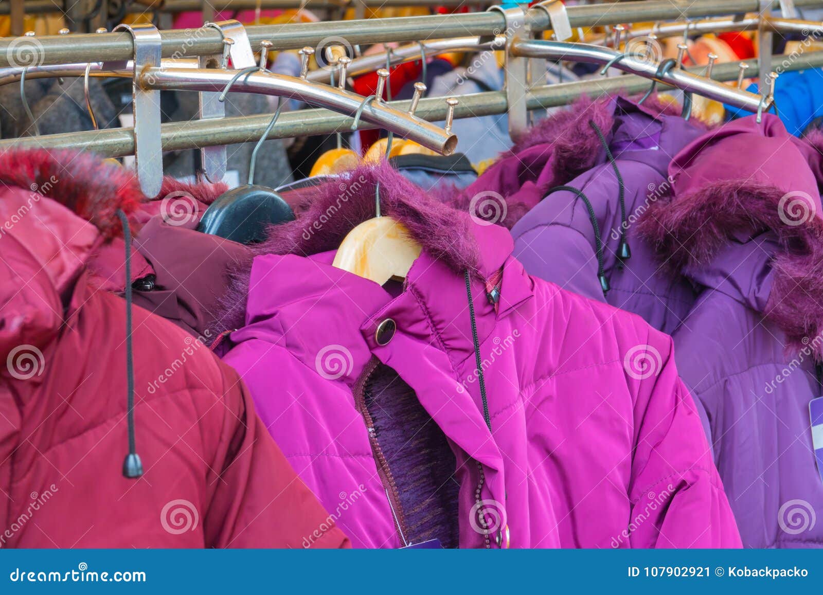 Fashion Winter Coats Hanged on a Clothes Rack Stock Image - Image of ...