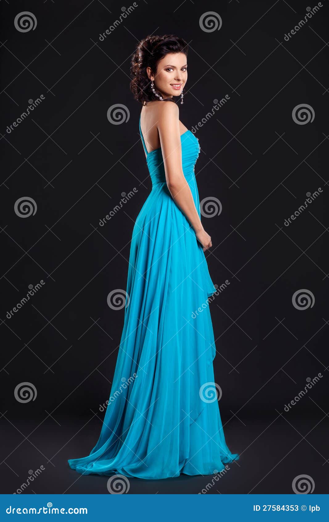fashion woman in funky blue long dress smiling