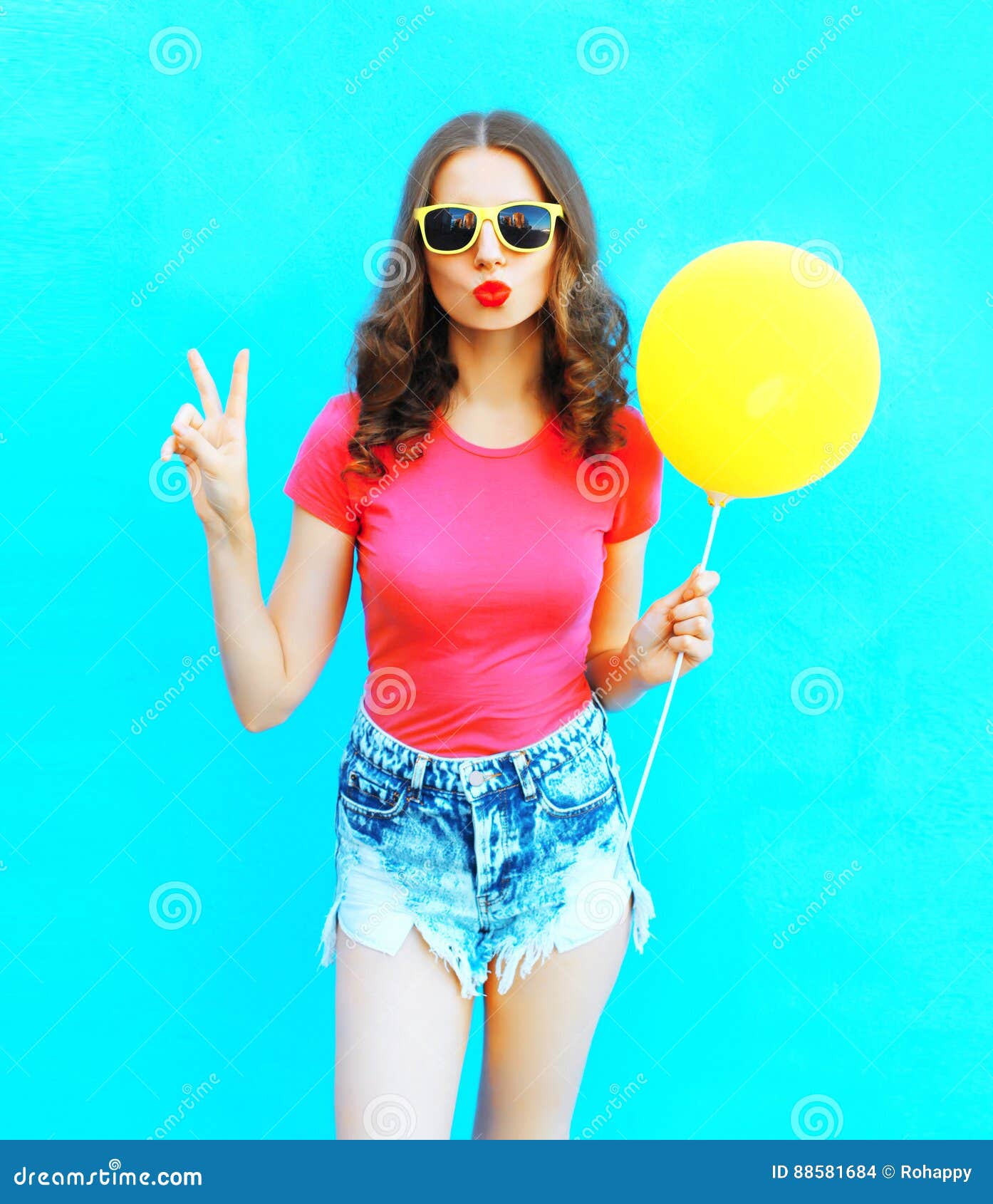 Fashion Woman Wearing a T-shirt, Denim Shorts with Yellow Air Balloon ...