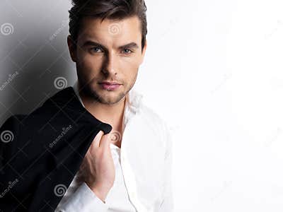 Fashion Young Man in White Shirt Holds the Black Jacket Stock Image ...