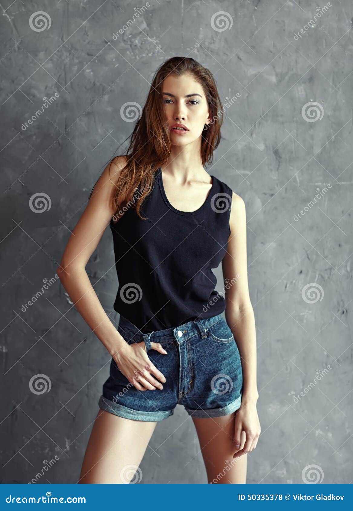 Fashion Young Woman on Grunge Wall Background Stock Photo - Image of ...
