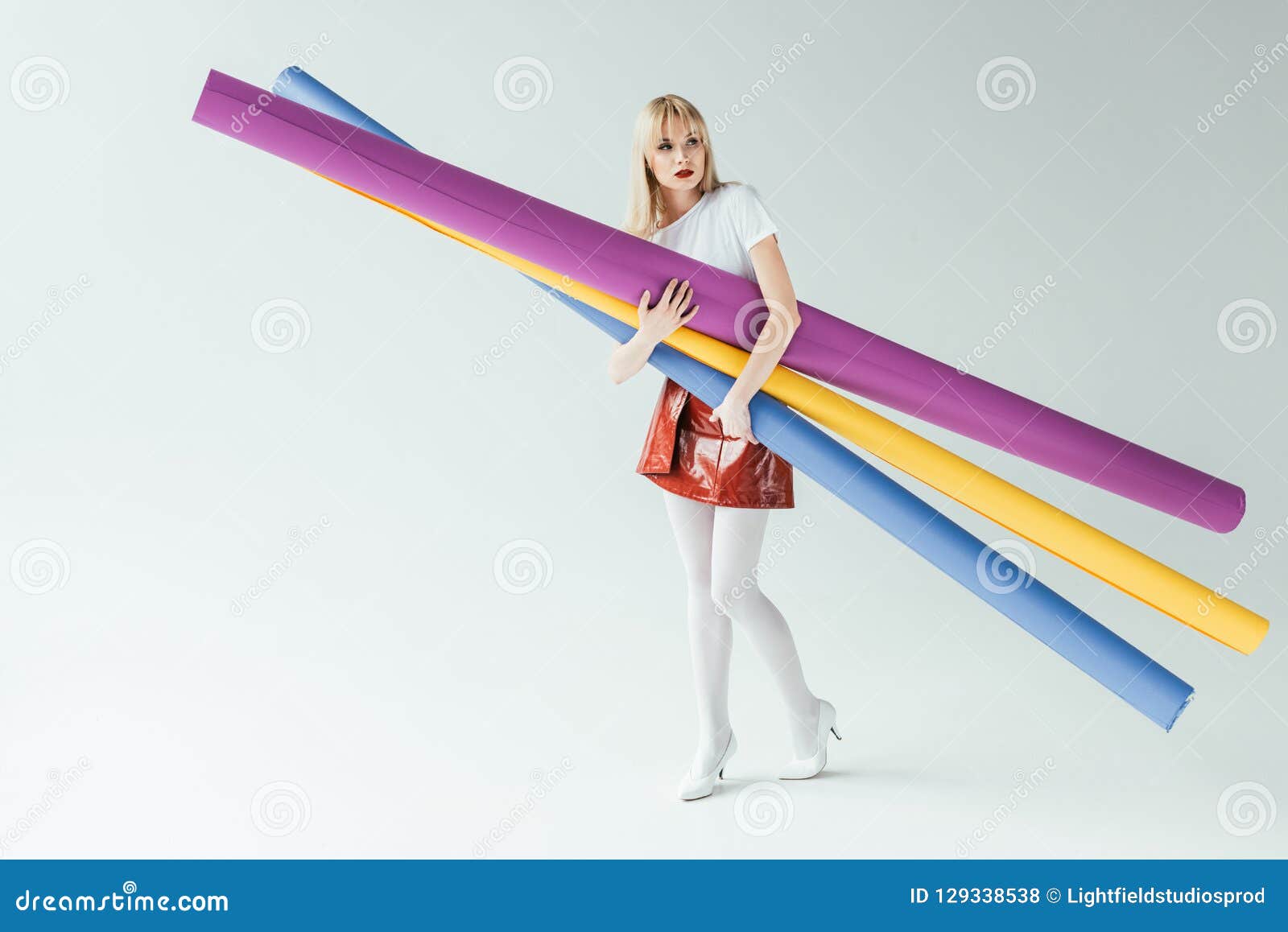 fashionable blonde girl carrying colorful