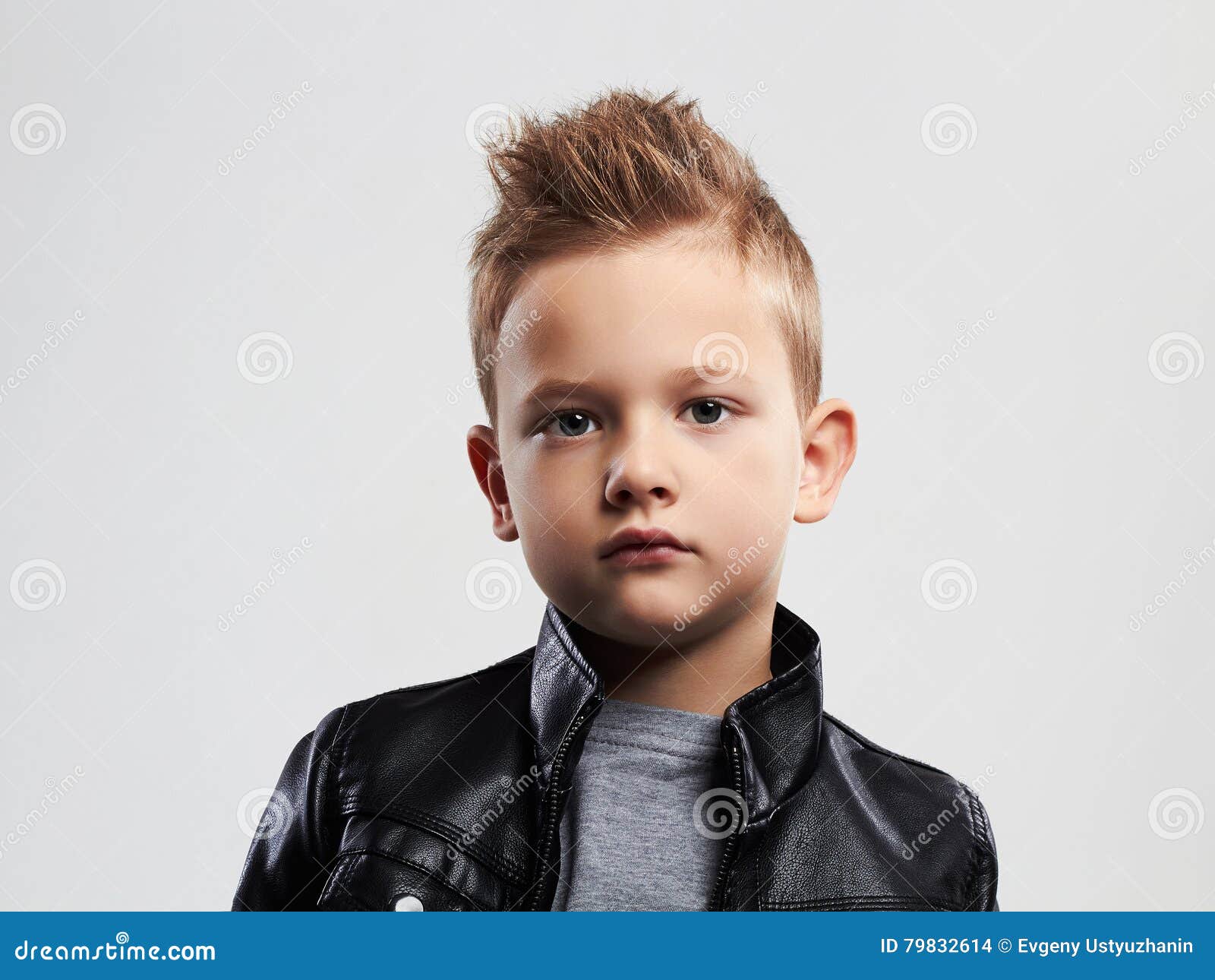 fashionable child leather coat stylish child trendy haircut little boy kids 79832614