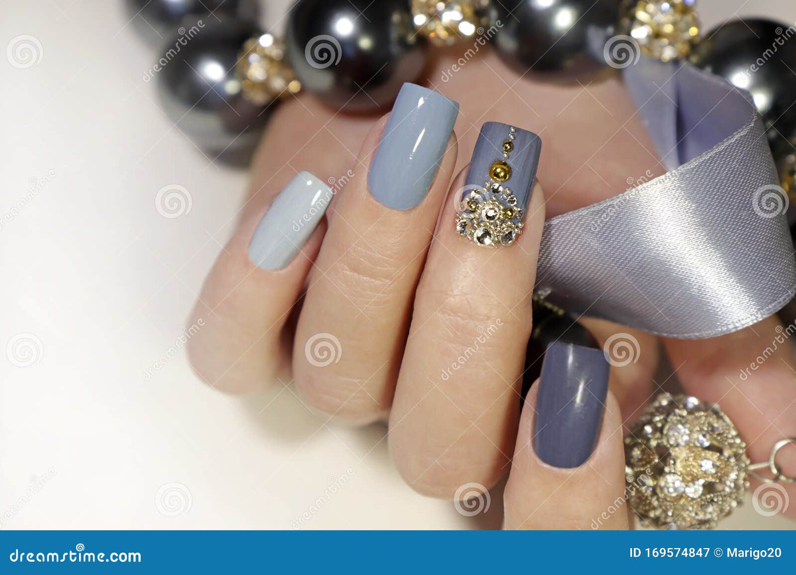 Female Hand with Glitter Blue Nail Design. Gray Nail Polish Manicure Stock  Photo - Image of blue, nails: 204271610