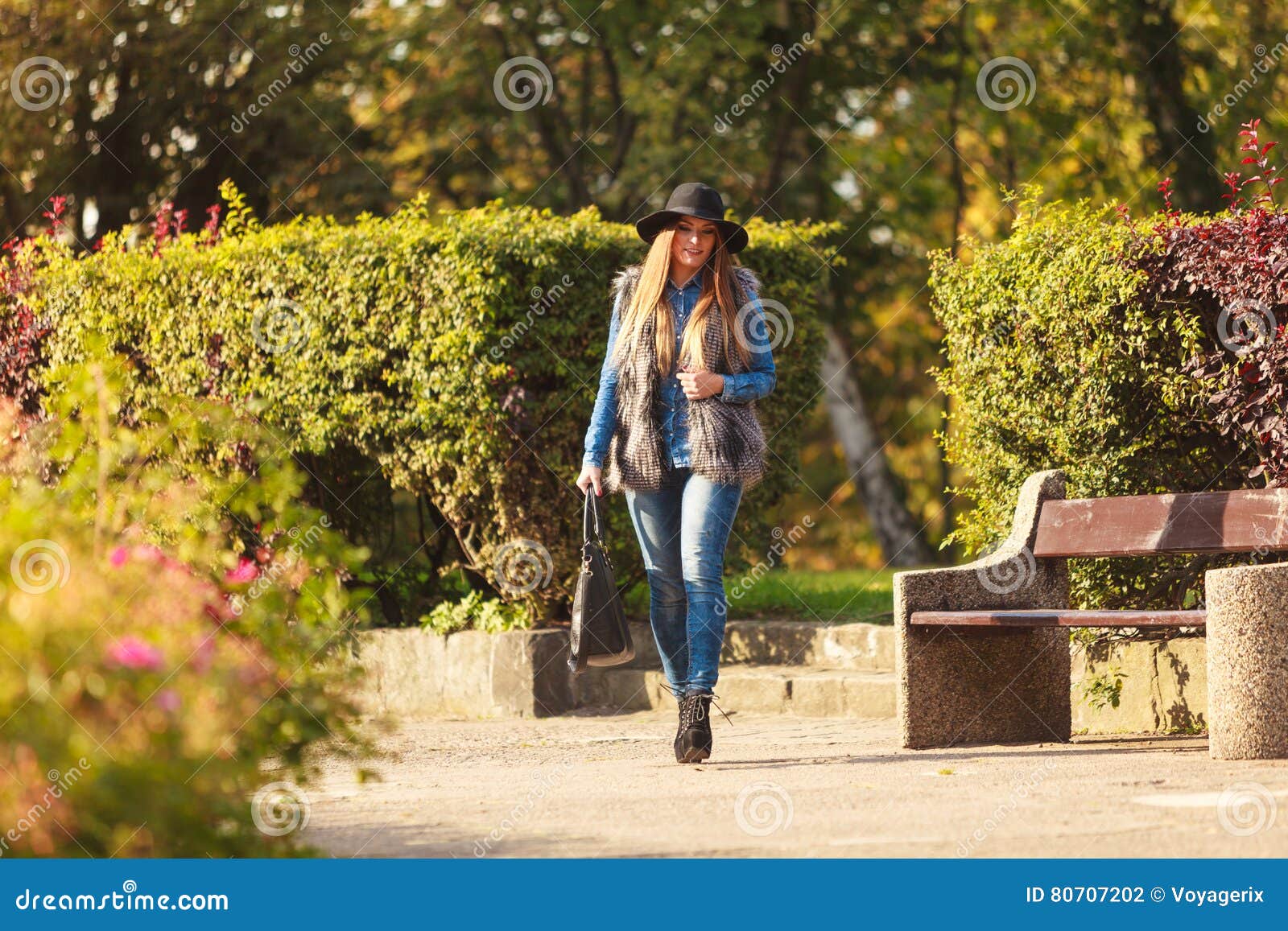 Fashionable Model Posing in Park Stock Photo - Image of clothing, boots ...