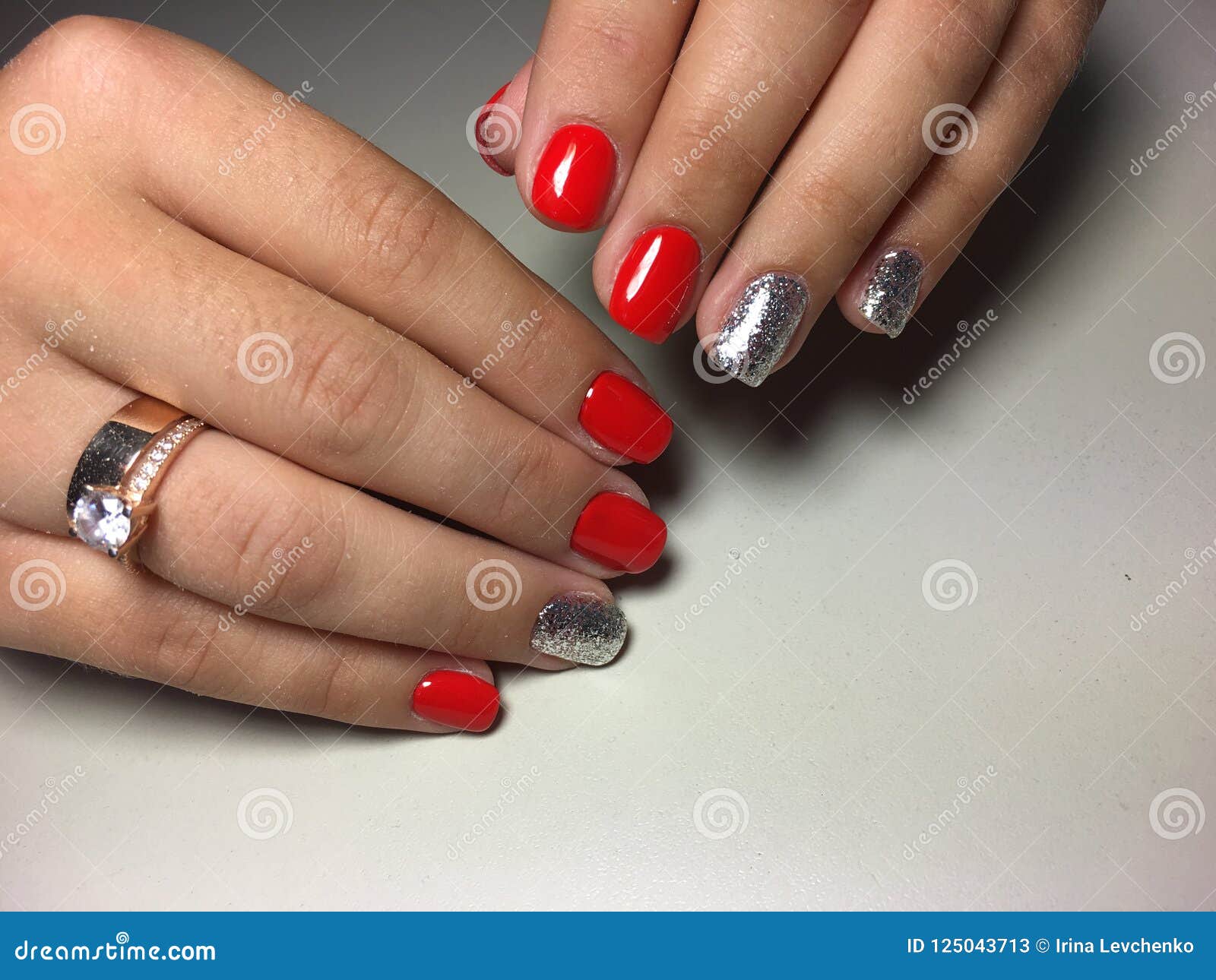 Fashionable Red Manicure with Gold Design Stock Image - Image of closeup, background: 125043713 Fashionable Red Manicure with Gold Design Stock Image - Image of closeup, background: 125043713