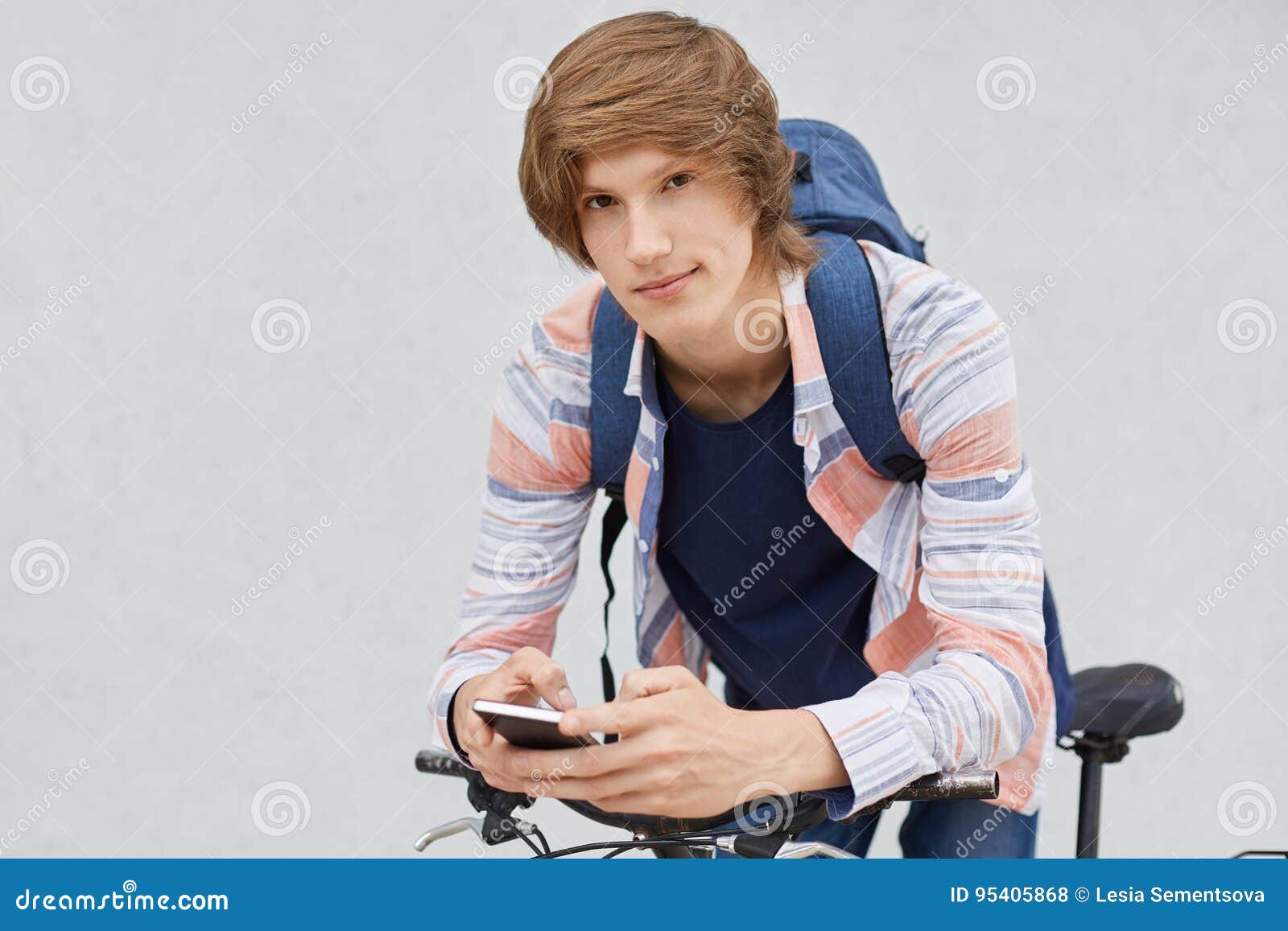 Fashionable Schoolboy Holding Backpack Wearing Shirt Using Cell Phone ...