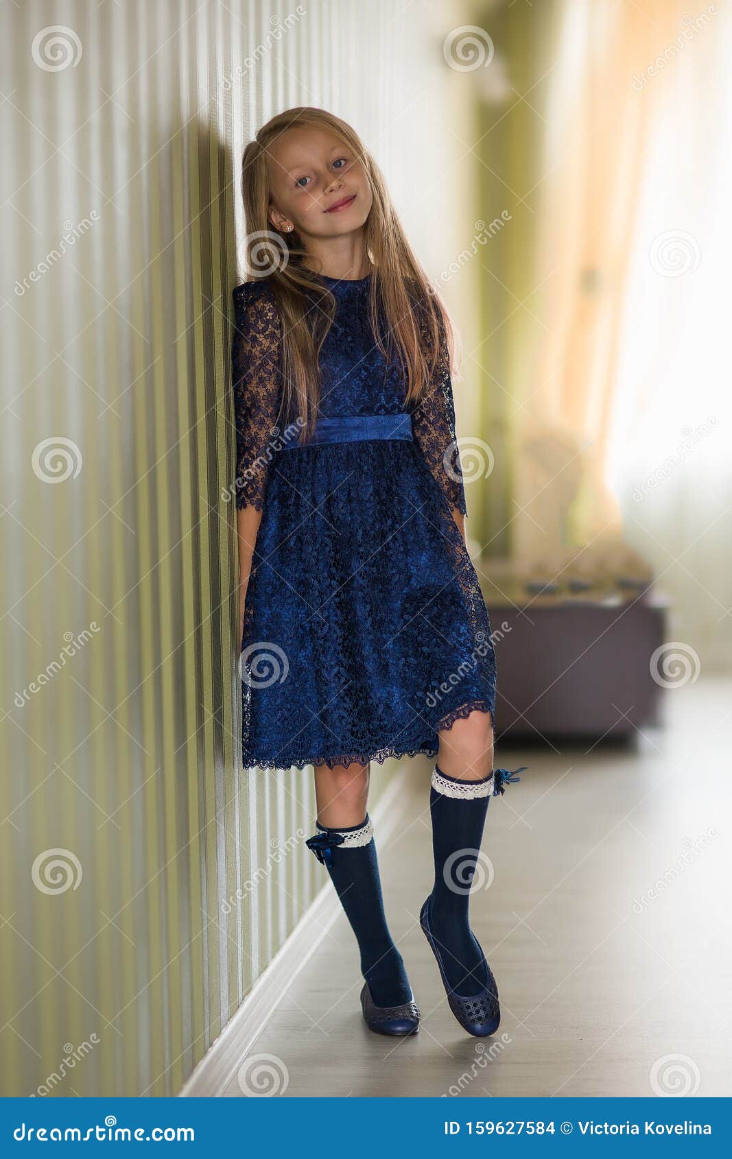 Fashionable Style of Clothes for Children. Little Little Girl Wearing a  Beautiful Lace Blue Dress. Girl Model with Long Hair Stock Photo - Image of  casual, fashionable: 159627584