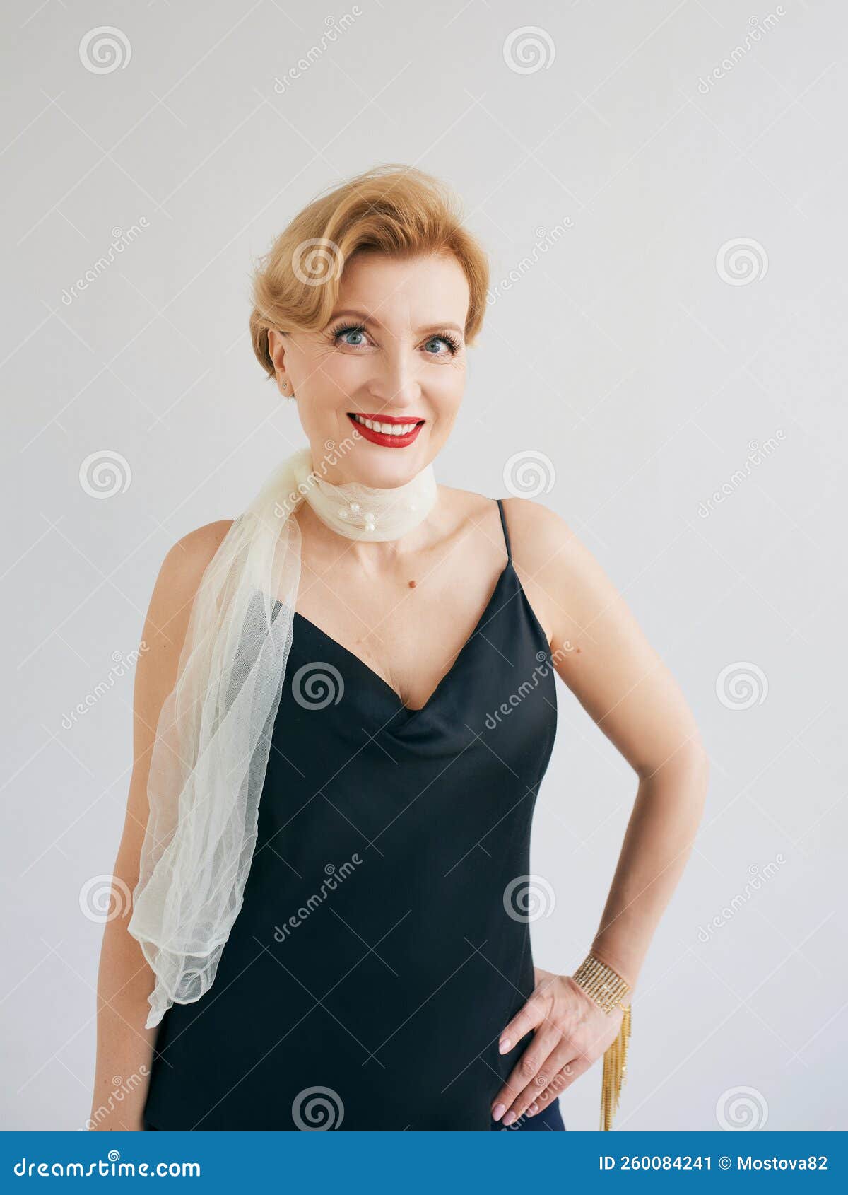 Fashionable Stylish Beautiful Mature Woman in Dress and Scarf. Stock
