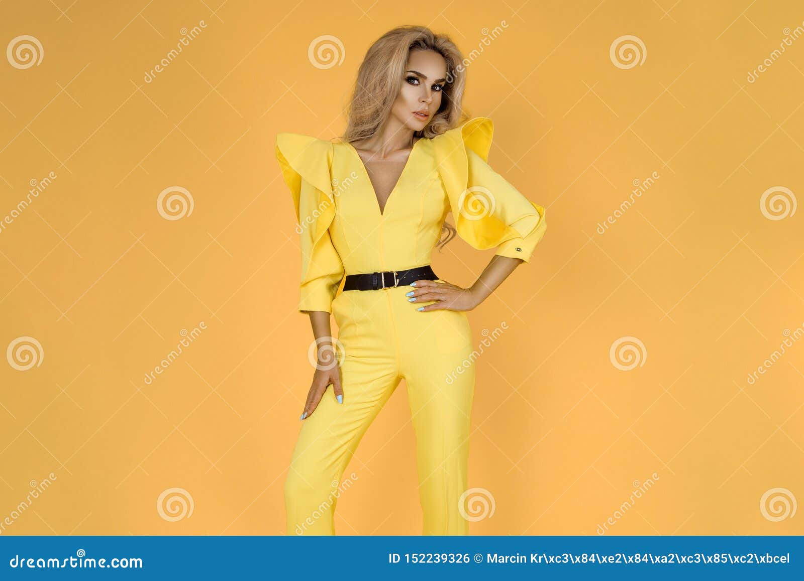 Fashionable Woman in Nice Yellow Jumpsuit, Shoes and Accessories ...