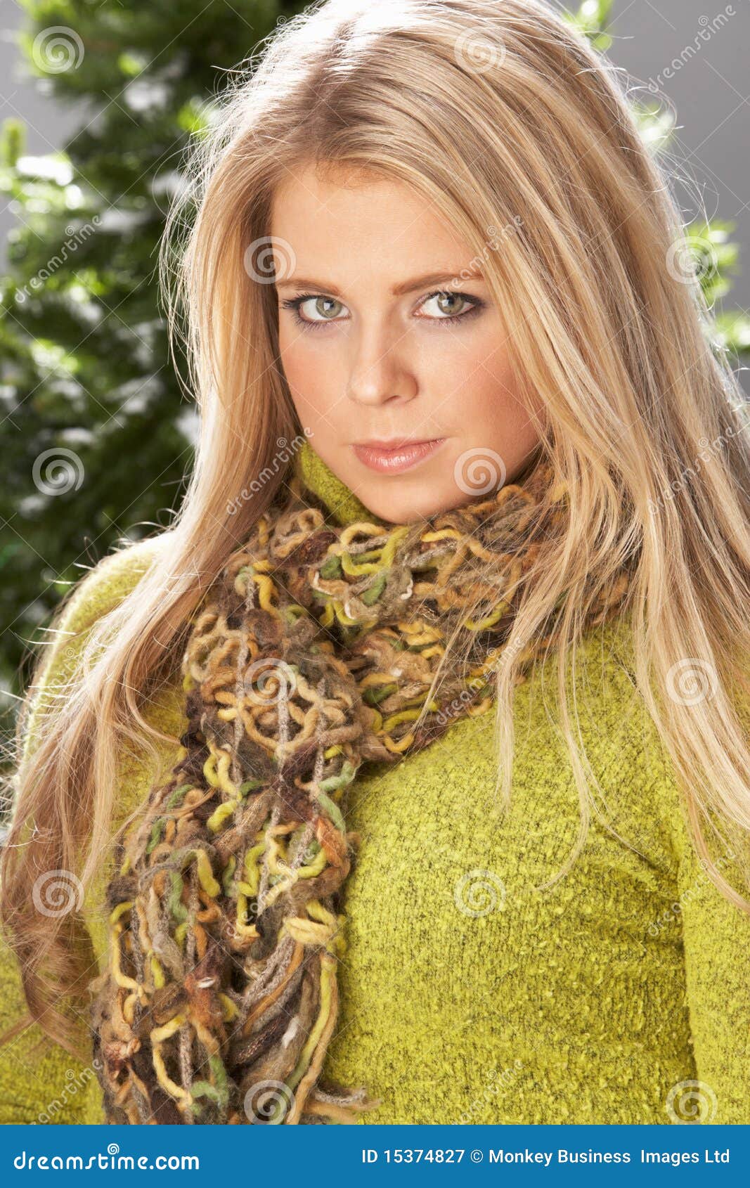fashionable woman wearing knitwear in studio