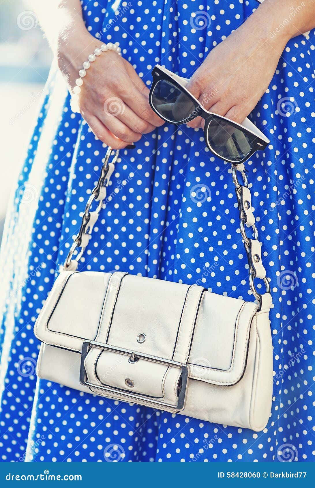 Fashionable Woman with White Bag in Her Hands and Blue Dress Stock ...