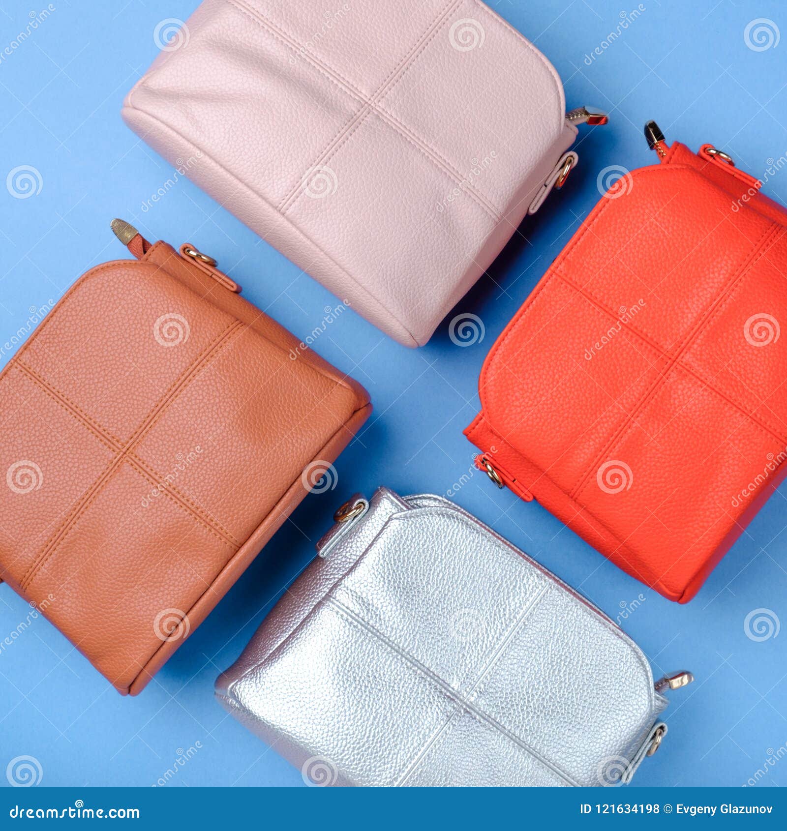 Fashionable Women`s Bags on a Colored Background. Top View. Stock Photo ...