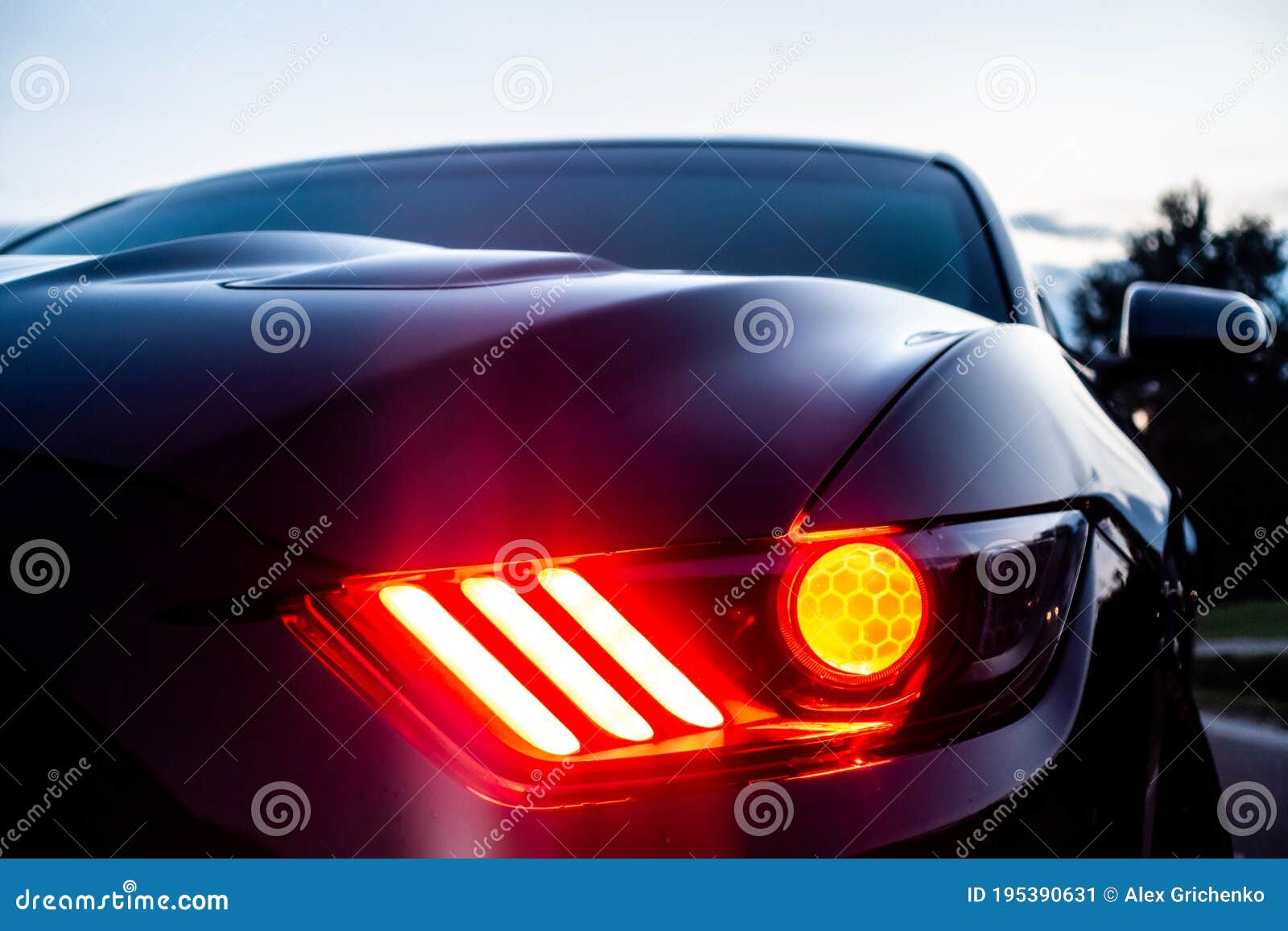 fast american power muscle car at sunset on road