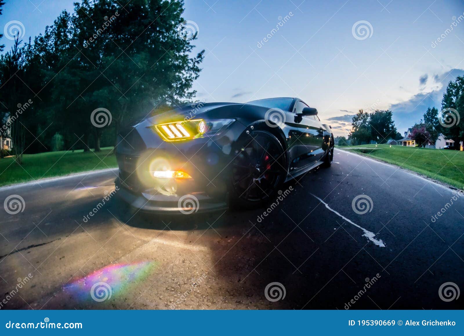 fast american power muscle car at sunset on road