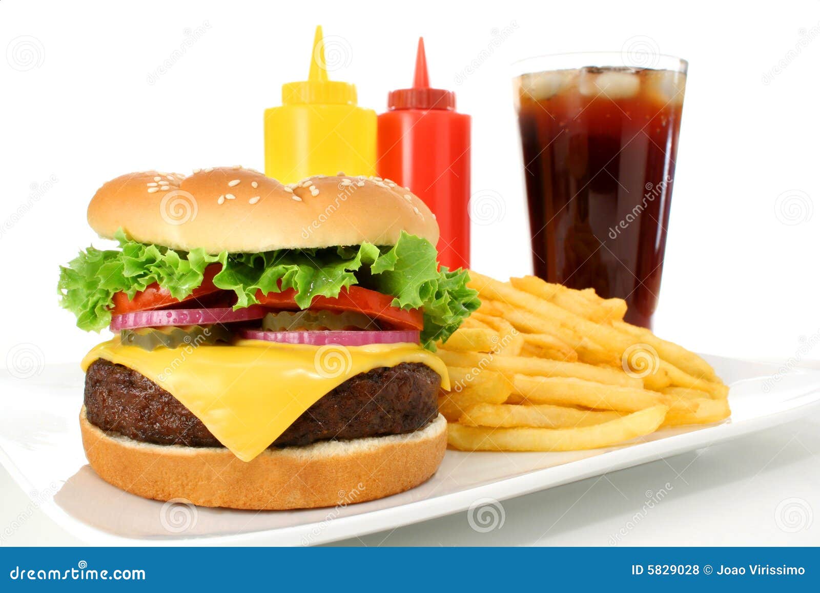 fast food meal including a cheeseburger hamburger, french fries and 