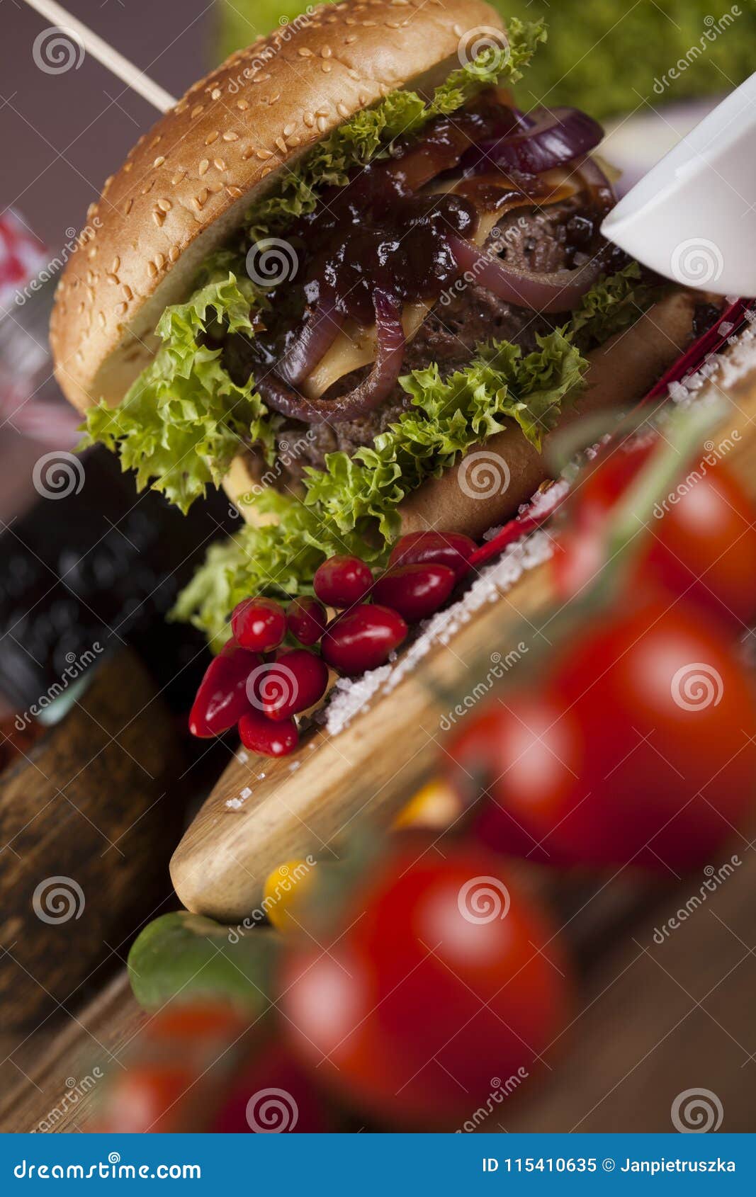 home made burgers on wooden background