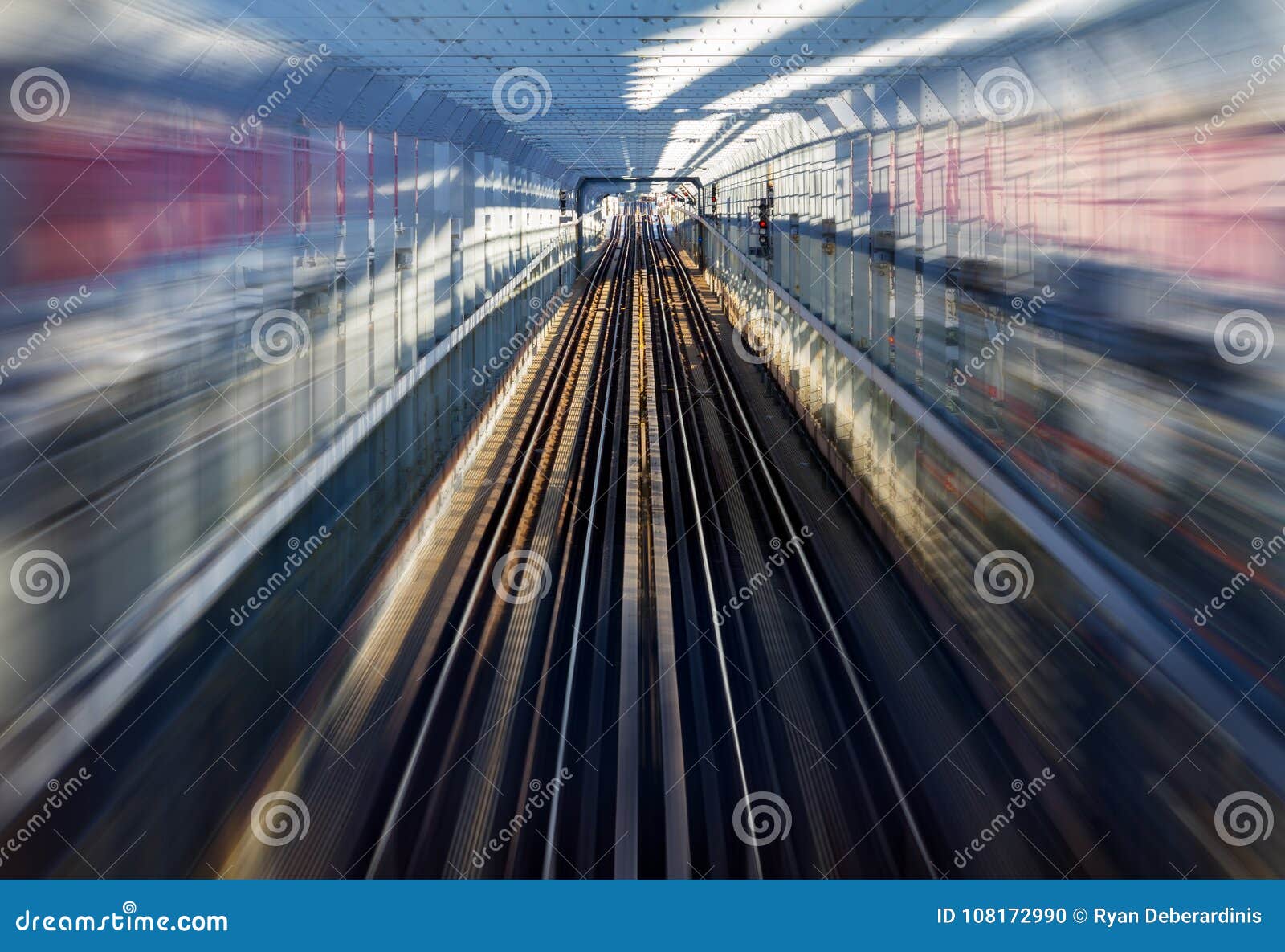 Fast Motion Zoom Effect in a Tunnel with Train Tracks Stock Photo