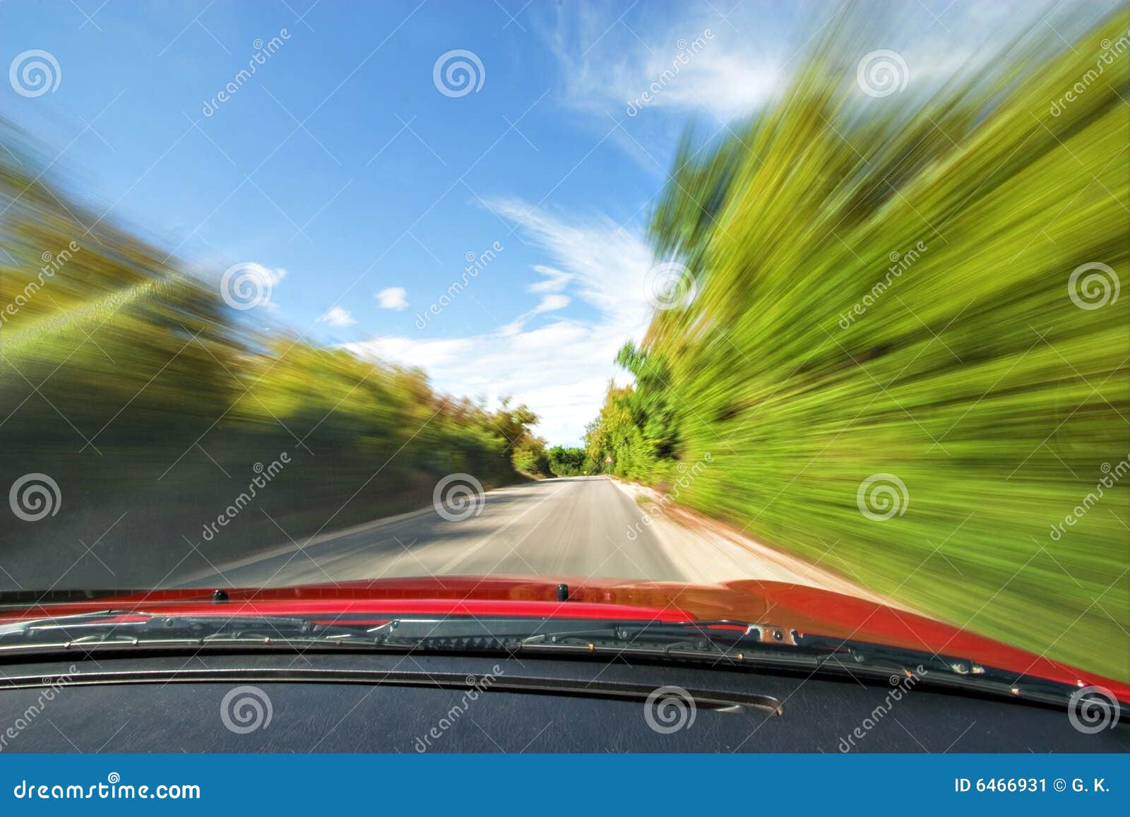 fast sport car driving in nature freeway