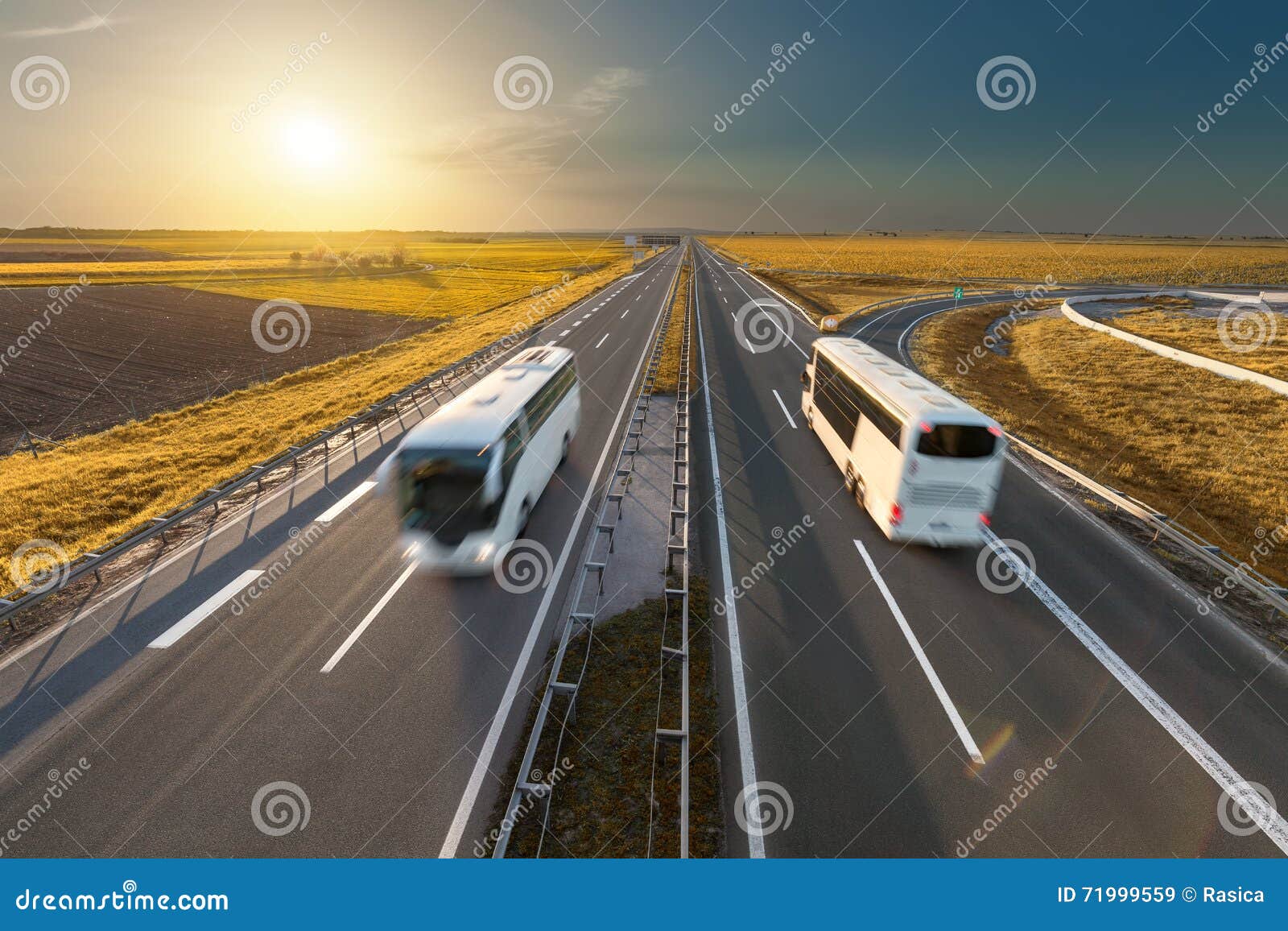 fast travel buses on the highway at idyllic sunset