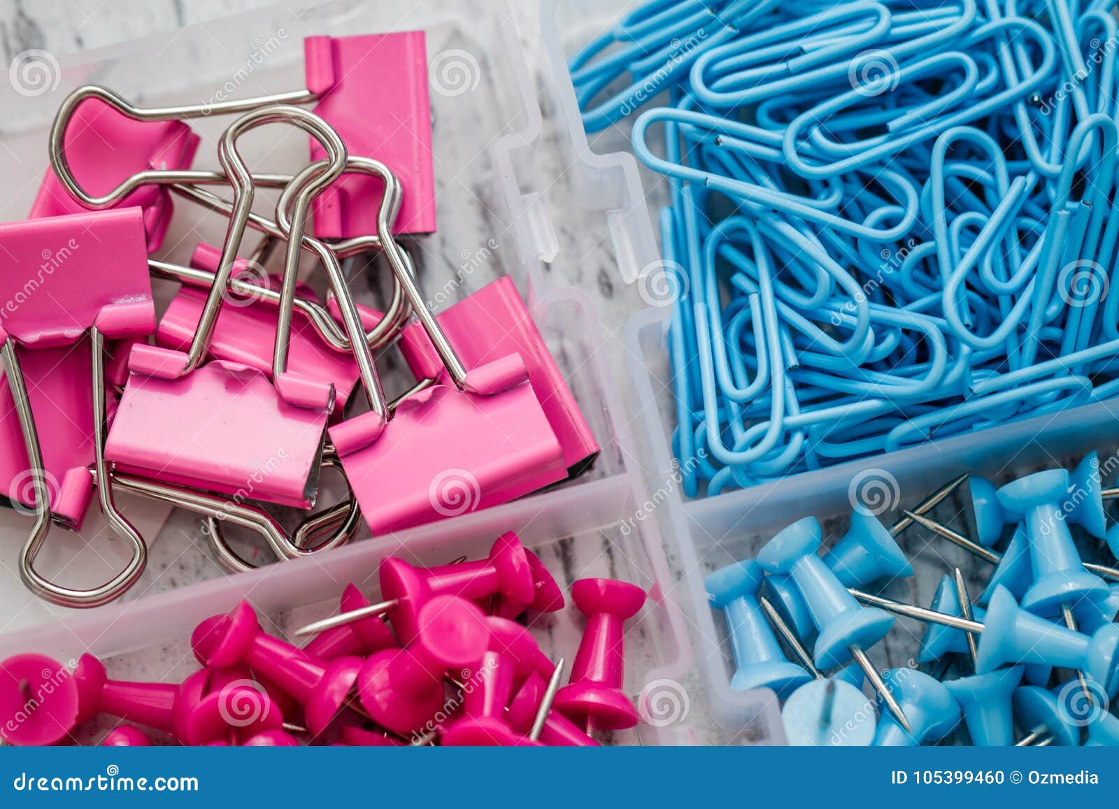 Fasteners Pins And Clips In Small Transparent Plastic Box Stock Photo