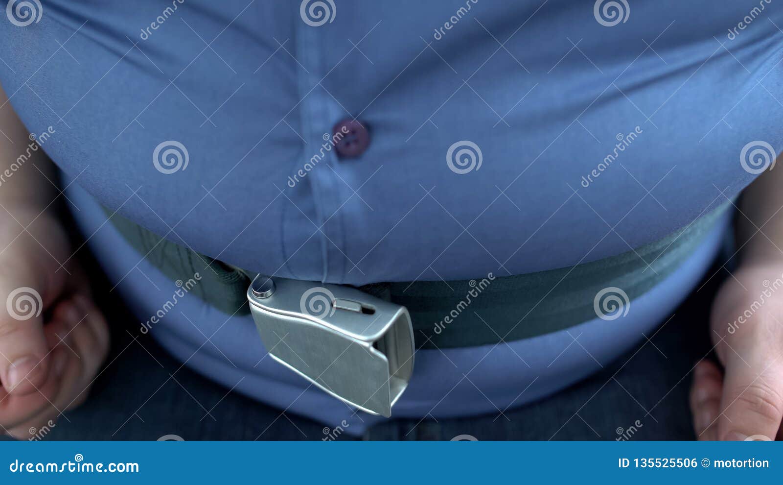 fat belly man hardly fastens safety belt, genetic predisposition, weight loss