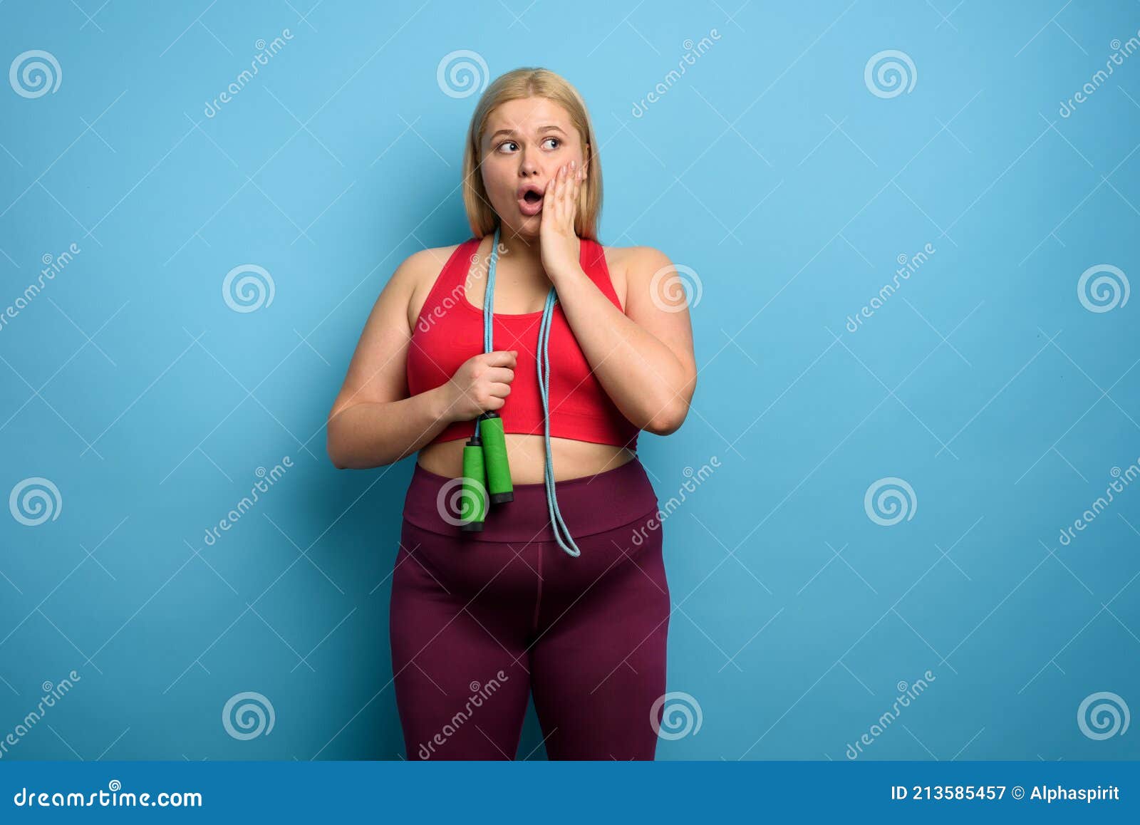 Fat Girl Does Gym but is Worried for Something. Cyan Background Stock ...