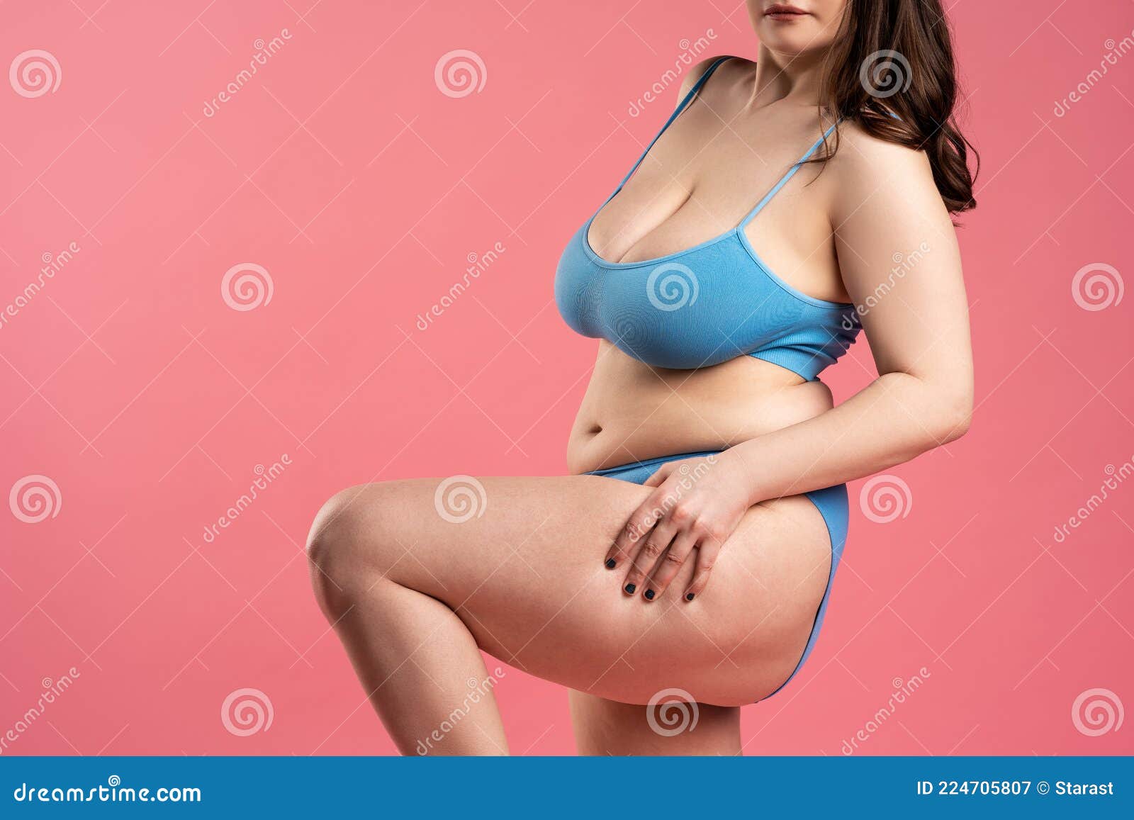 Woman In Blue Top Bra With Very Large Saggy Breasts On Pink