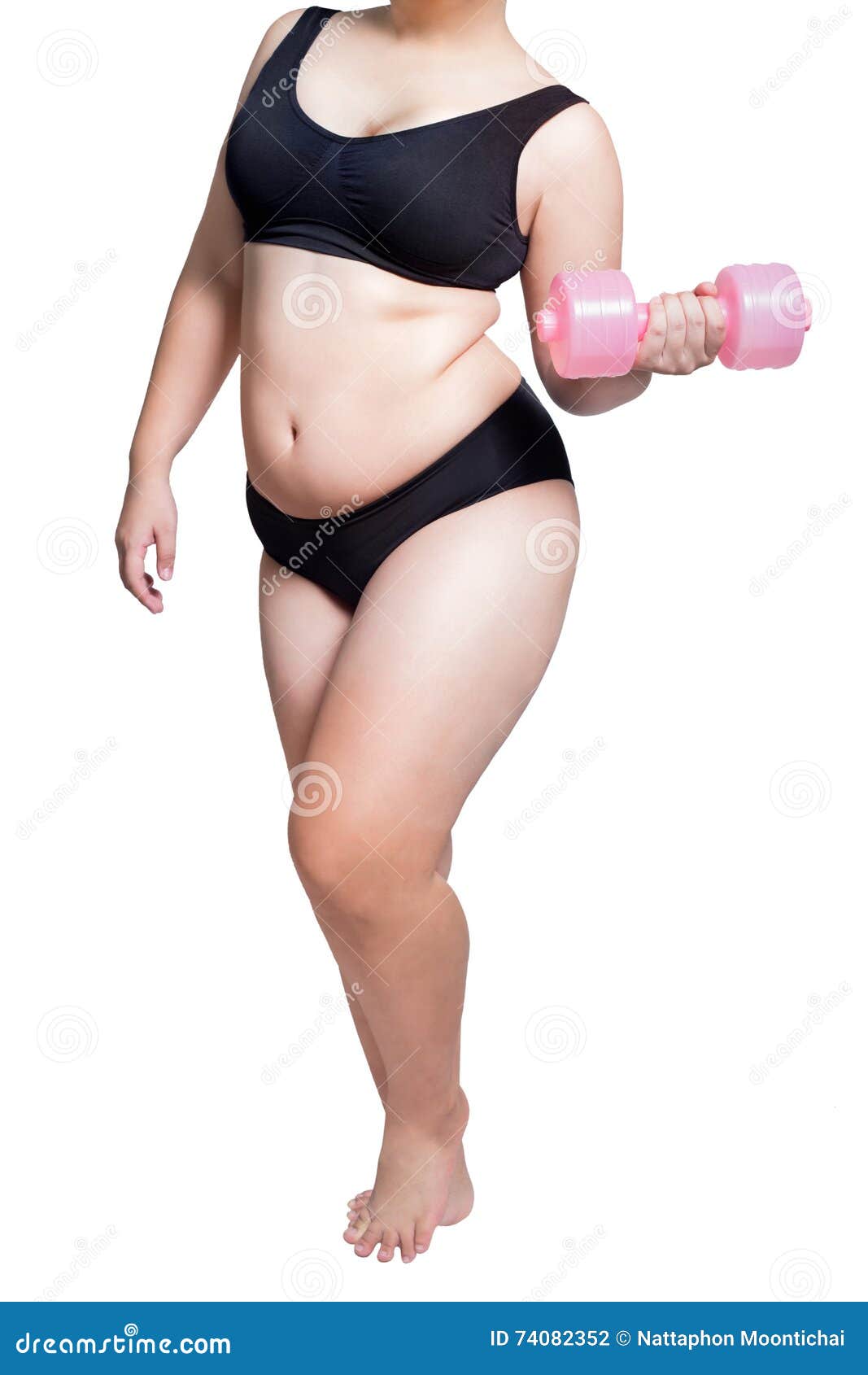 Fat girl in fitness clothes doing exercise with dumbbells on mat at home.  fitness concept for good health. weight control. fat belly, healthy body,  yoga 13095327 Stock Photo at Vecteezy